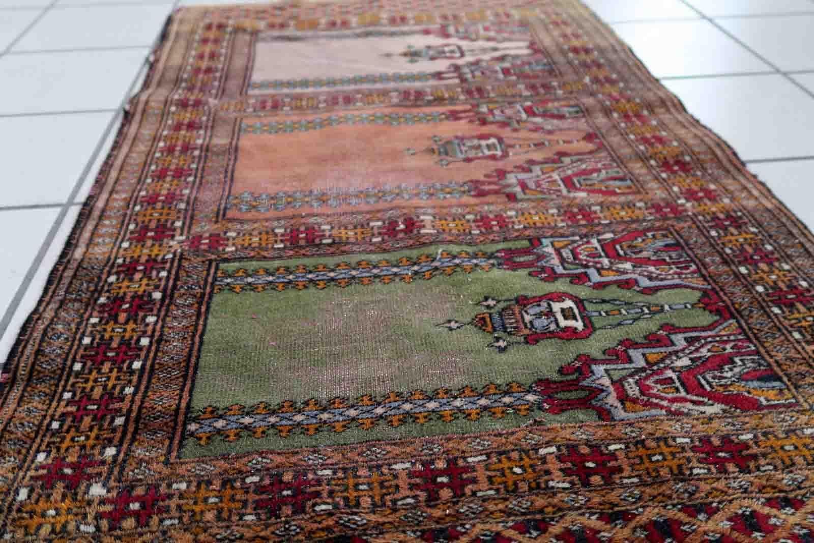 Handmade vintage Uzbek Bukhara rug in prayer design. The rug is from the middle of 20th century made in wool. The rug is in original condition, has some low pile

-condition: original, some low pile,

-circa: 1950s,

-size: 2' x 3.2' (63cm x