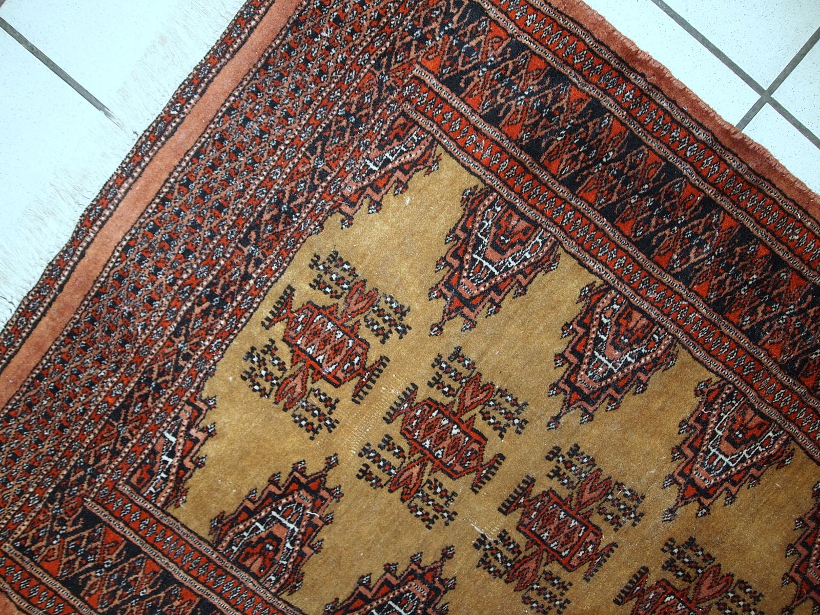 Handmade vintage Uzbek Bukhara rug in original condition, it has some age wear. The rug made in soft wool in the middle of 20th century. 

-condition: original, some signs of age,

-circa 1960s,

-size: 2.5' x 3.9' (77cm x
