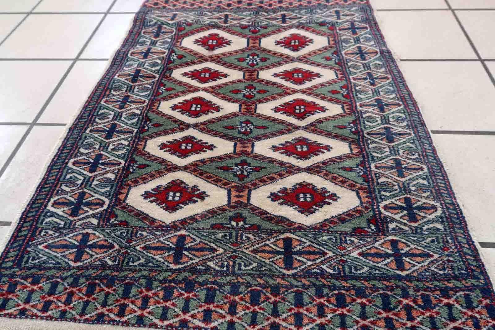 Handmade vintage Bukhara rug in unusual colors. The rug is in original good condition, it is from the end of 20th century.

-condition: original good,

-circa: 1970s,

-size: 1.8' x 2.7' (56cm x 83cm),

-material: wool,

-country of origin:
