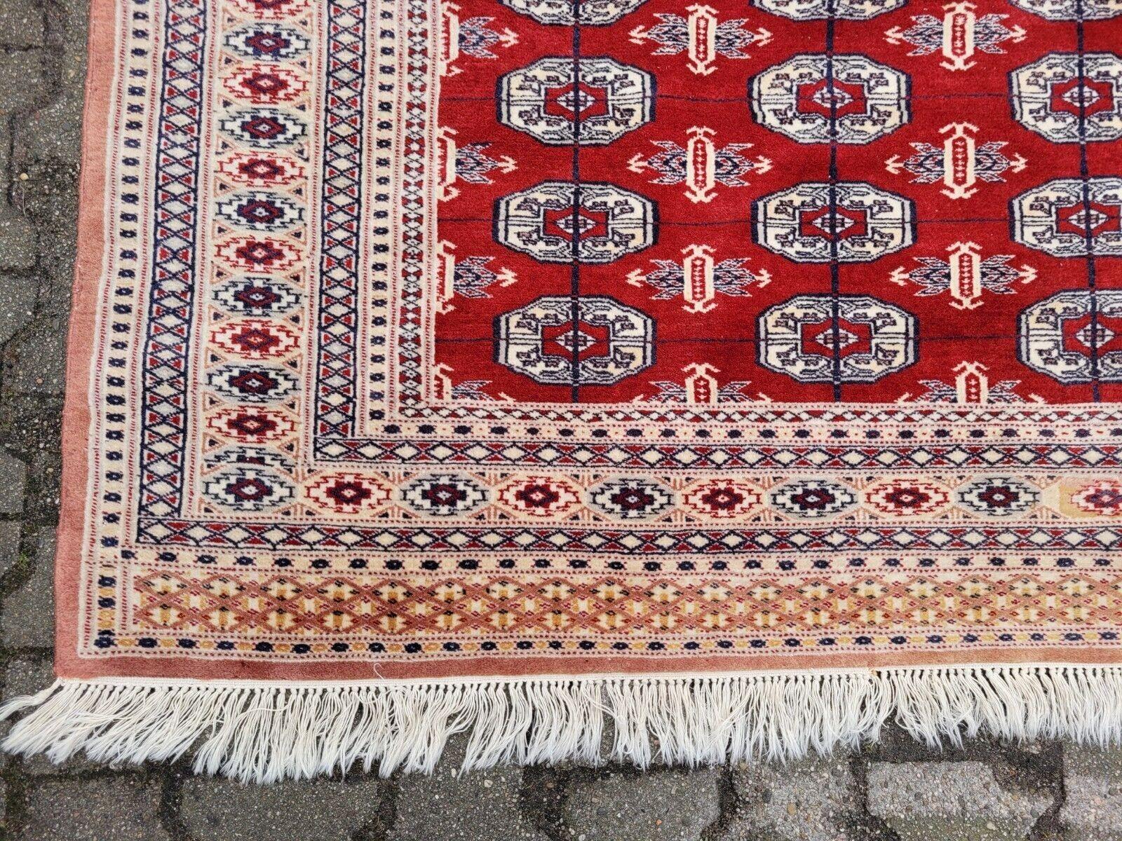 Lana Tappeto Uzbek Bukhara vintage fatto a mano 4,2' x 5,9' 1960 - 2K22 in vendita