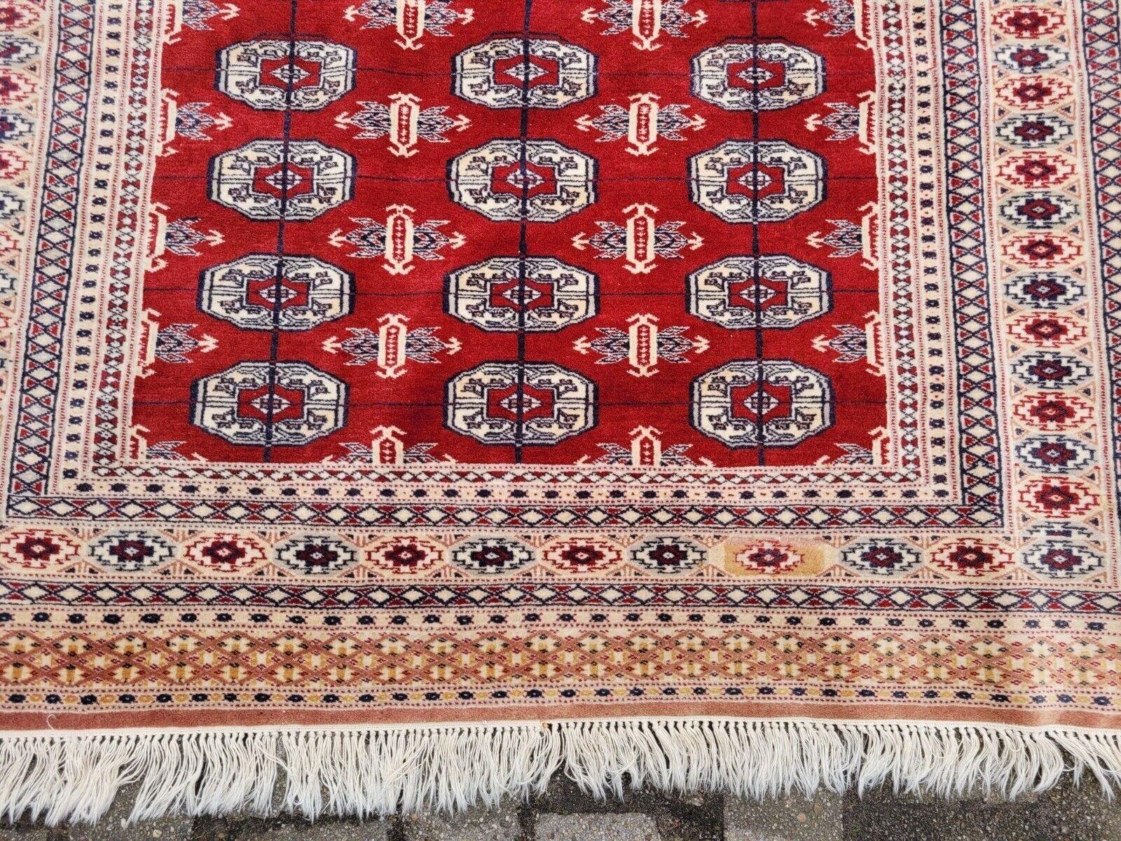 Tappeto Uzbek Bukhara vintage fatto a mano 4,2' x 5,9' 1960 - 2K22 in vendita 1