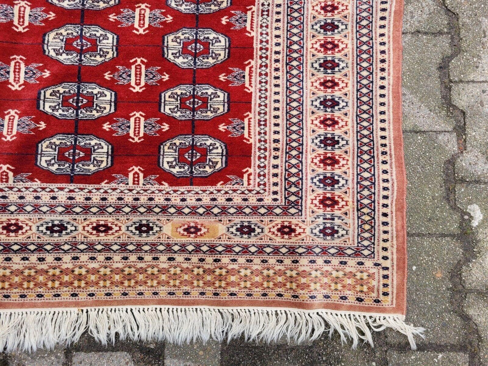 Tappeto Uzbek Bukhara vintage fatto a mano 4,2' x 5,9' 1960 - 2K22 in vendita 2