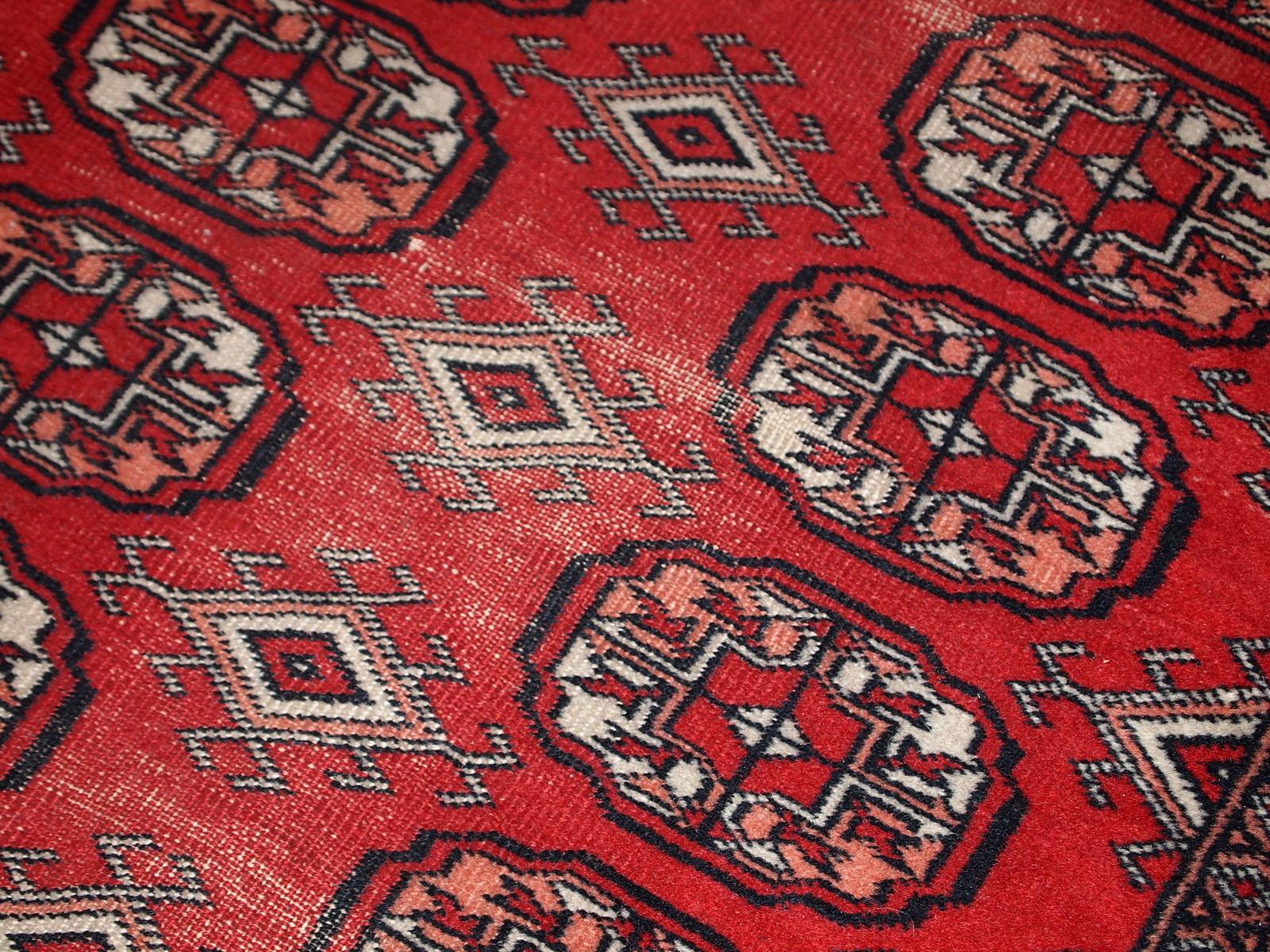 Handmade vintage Uzbek Bukhara runner in original condition, it has some age wear. The rug made in soft wool in the middle of 20th century. 

-condition: original, some signs of age,

-circa: 1960s,

-size: 2.7' x 9' (83cm x