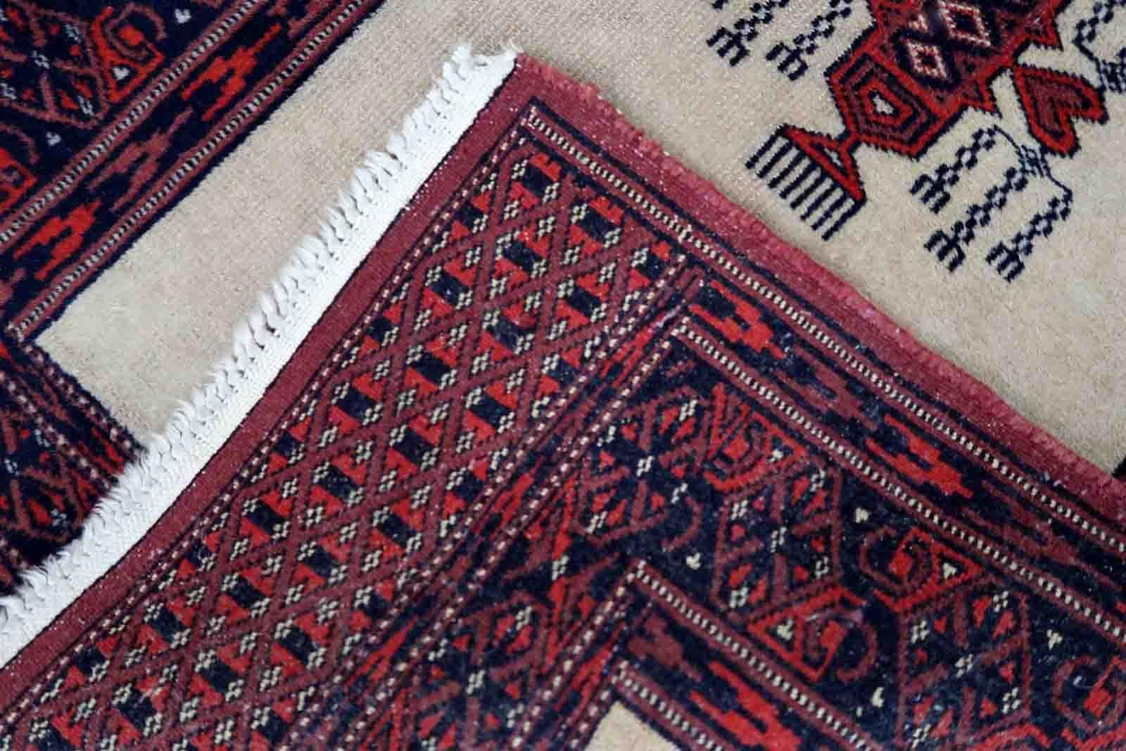 Handmade vintage Uzbek Bukhara runner in traditional design. The rug is from the end of 20th century made in wool.

-condition: original, some age wear,

-circa: 1960s,

-size: 2' x 6.2' (61cm x 190cm),
?
-material: wool,

-country of