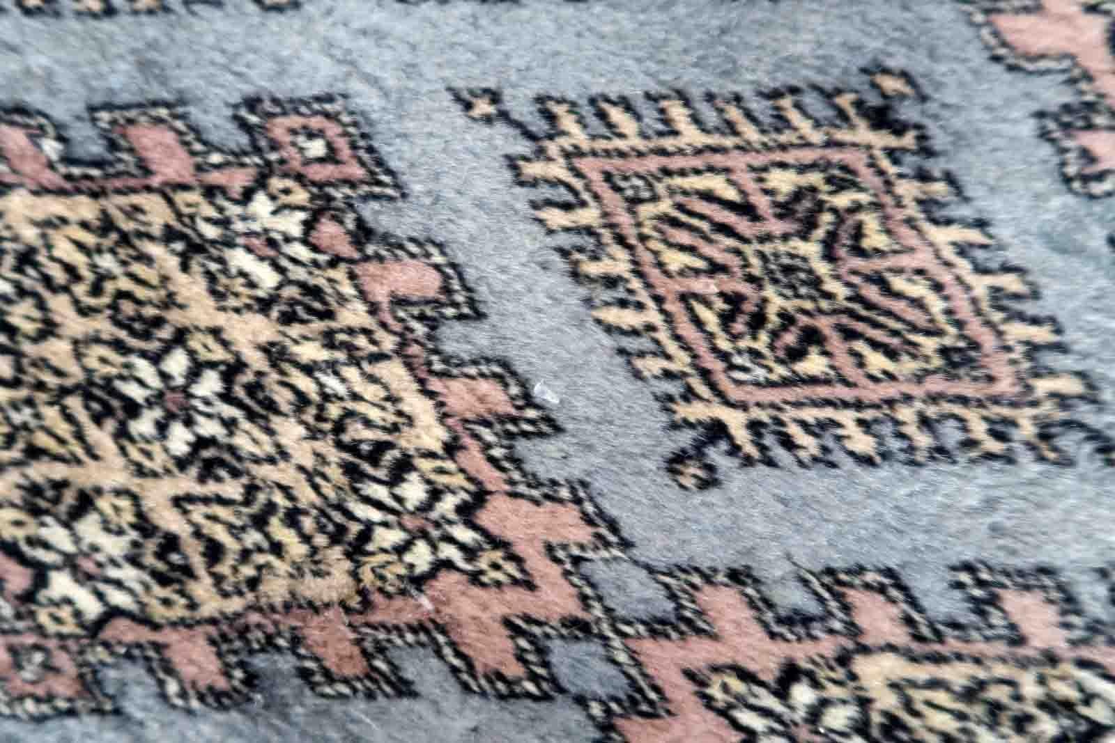 Handmade vintage Uzbek Bukhara runner in traditional design. The rug is from the end of 20th century made in wool.

-condition: original, one corner is damaged,

-circa: 1960s,

-size: 2.4' x 8' (75cm x 244cm),
?
-material: wool,

-country