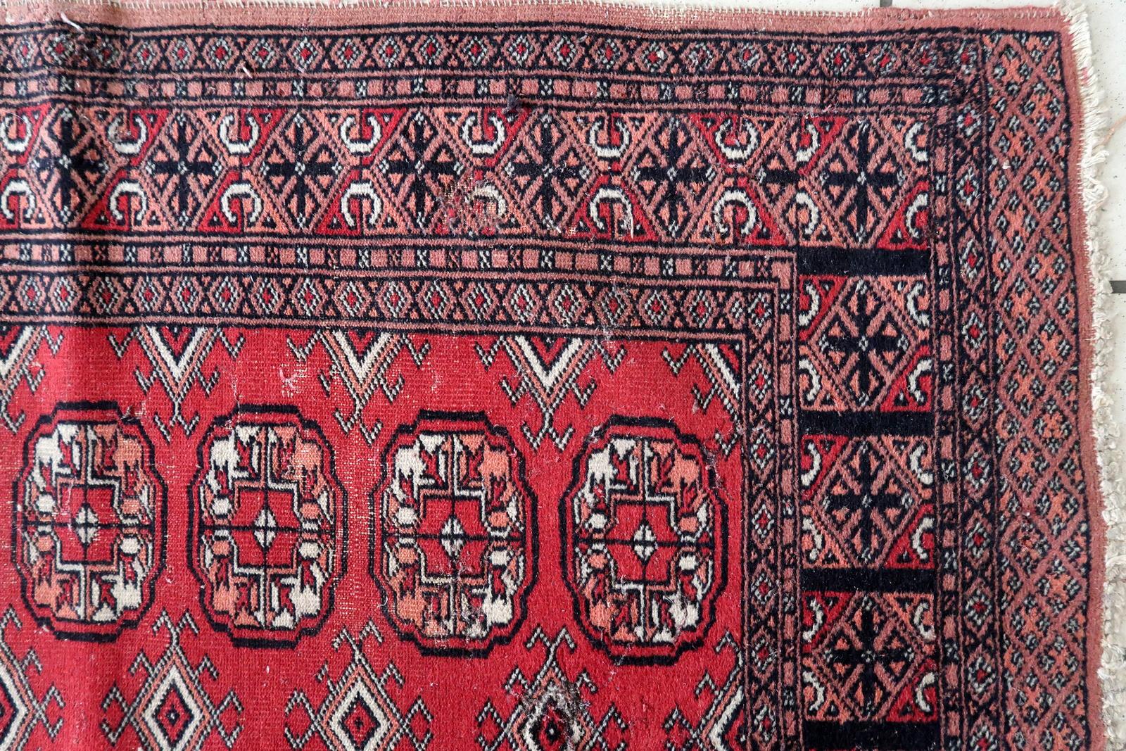 Elevate your space with this captivating Handmade Vintage Uzbek Bukhara Runner. Crafted in the 1960s, it carries a rich history and timeless allure. Measuring 2.6' x 8.9' (80cm x 274cm), it's the perfect addition to your home.

This piece boasts