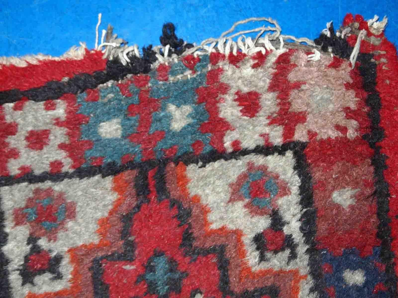 Vintage handmade Middle Eastern mat in original condition, it has some age wear. The rug is from the end of 20th century.

-condition: original, some age wear,

-circa: 1960s,

-size: 1.4' x 2.2' (42cm x 68cm),

-material: wool,

-country