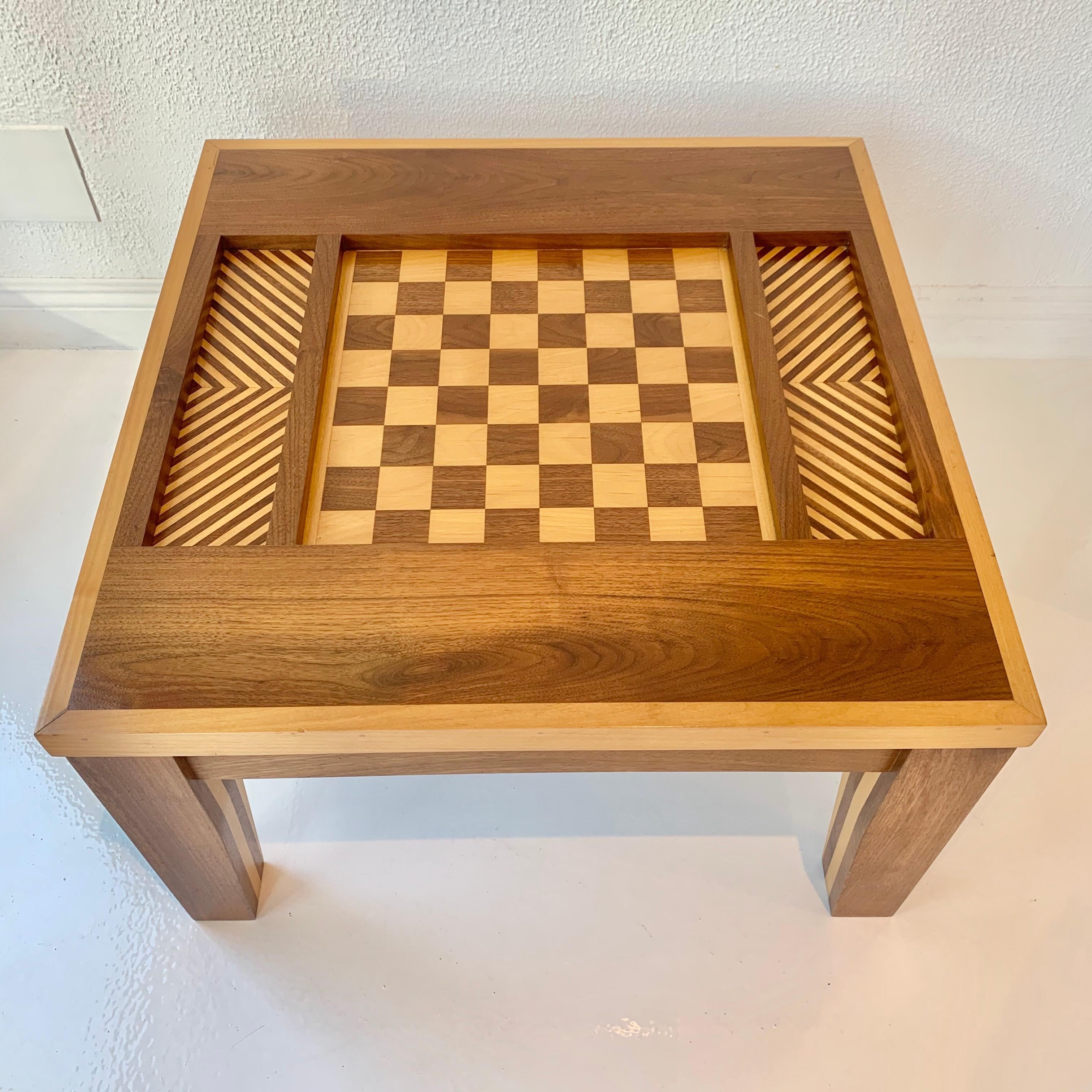 Stunning handmade chess table made of Walnut and Alder. Gorgeous coloring. Parquet design flank both sides of the alternating wood game board. Perfect game table. Great as a side table between two chairs when not in use.