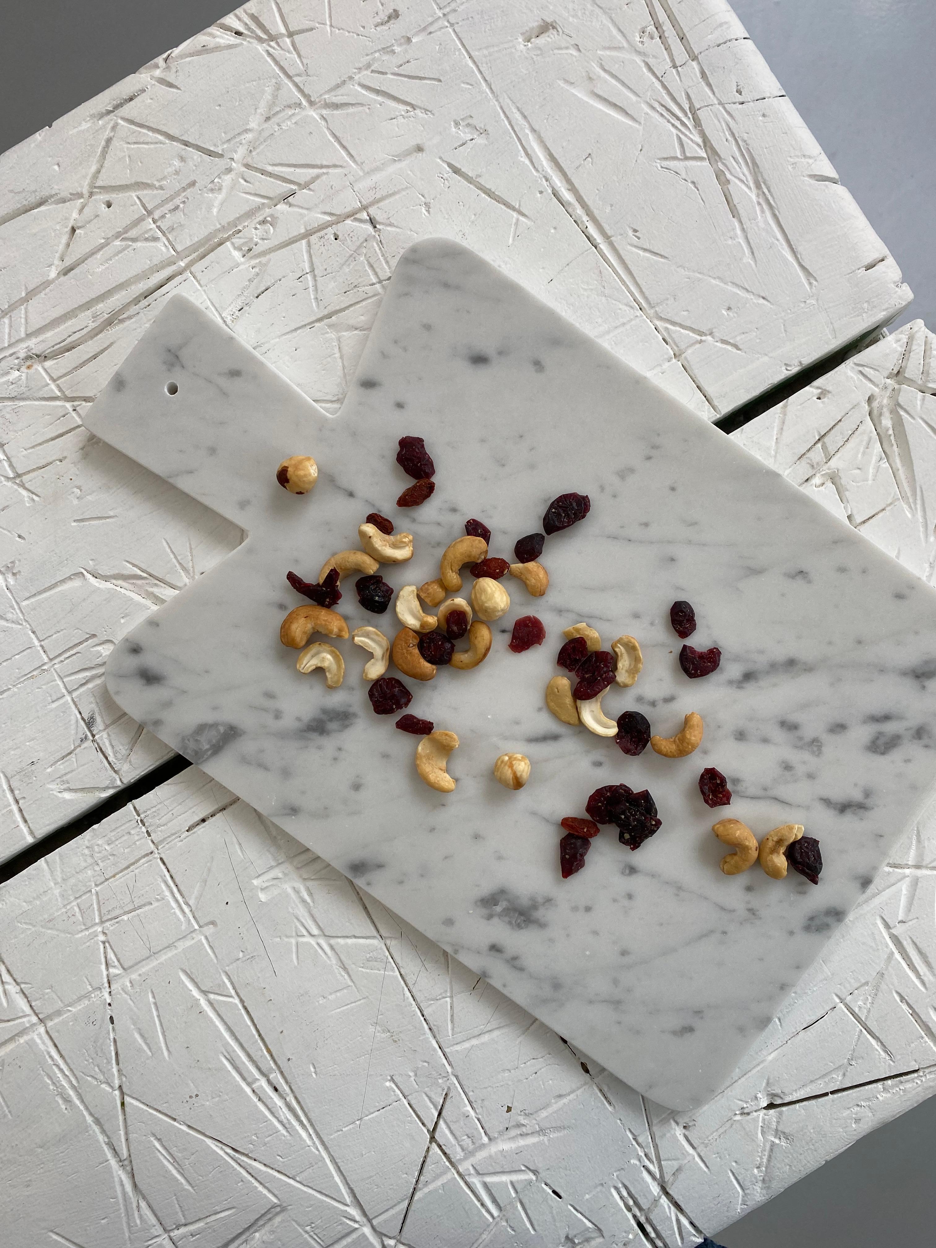 white marble cutting board with handle
