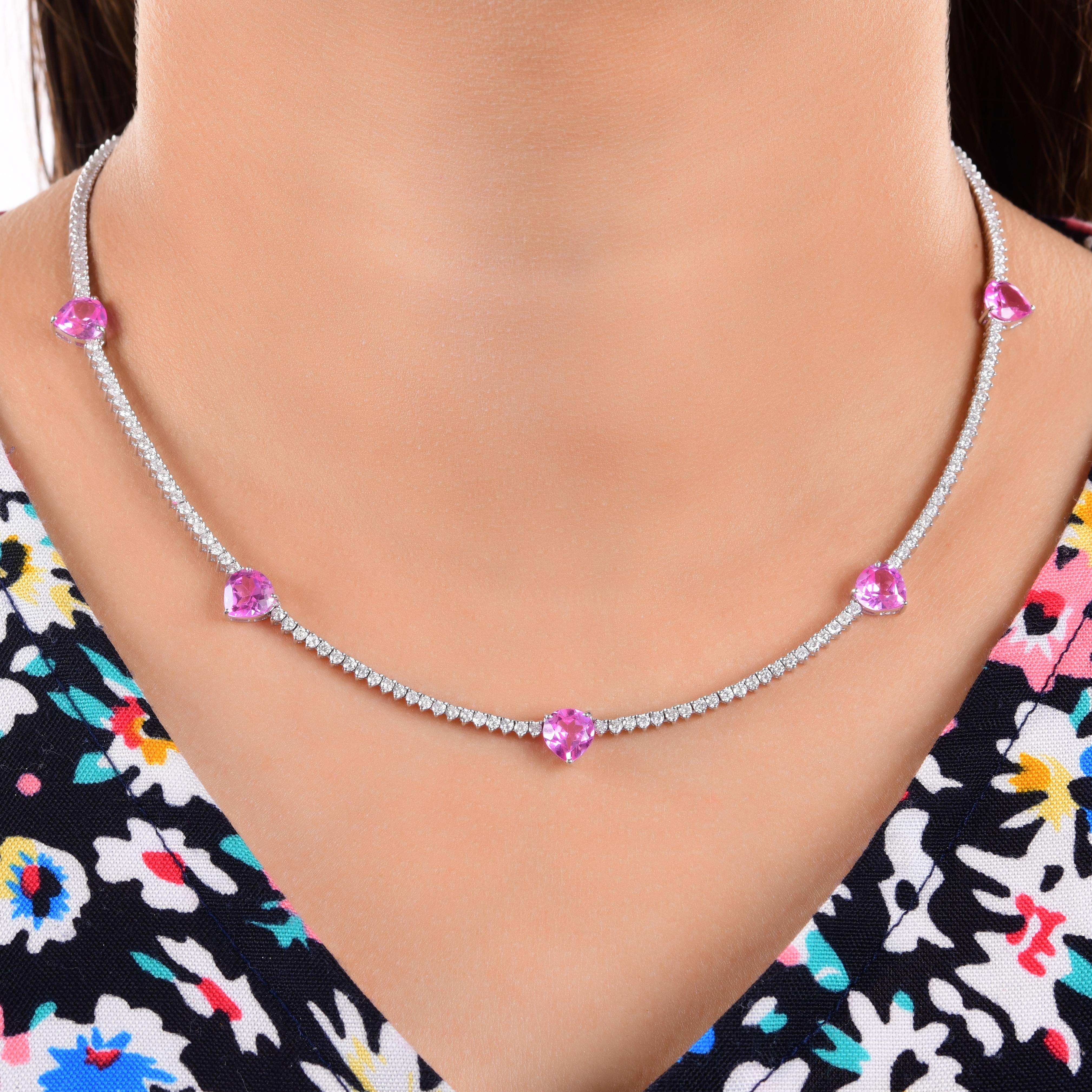 Handmade White Gold Diamond 14k White Gold Necklace with Pink Heart Gemstones
The design features a sleek diamond tennis chain adorned with five heart-shaped pink gemstones. 
Diamonds are a universal symbol of eternity, strength, and elegance a