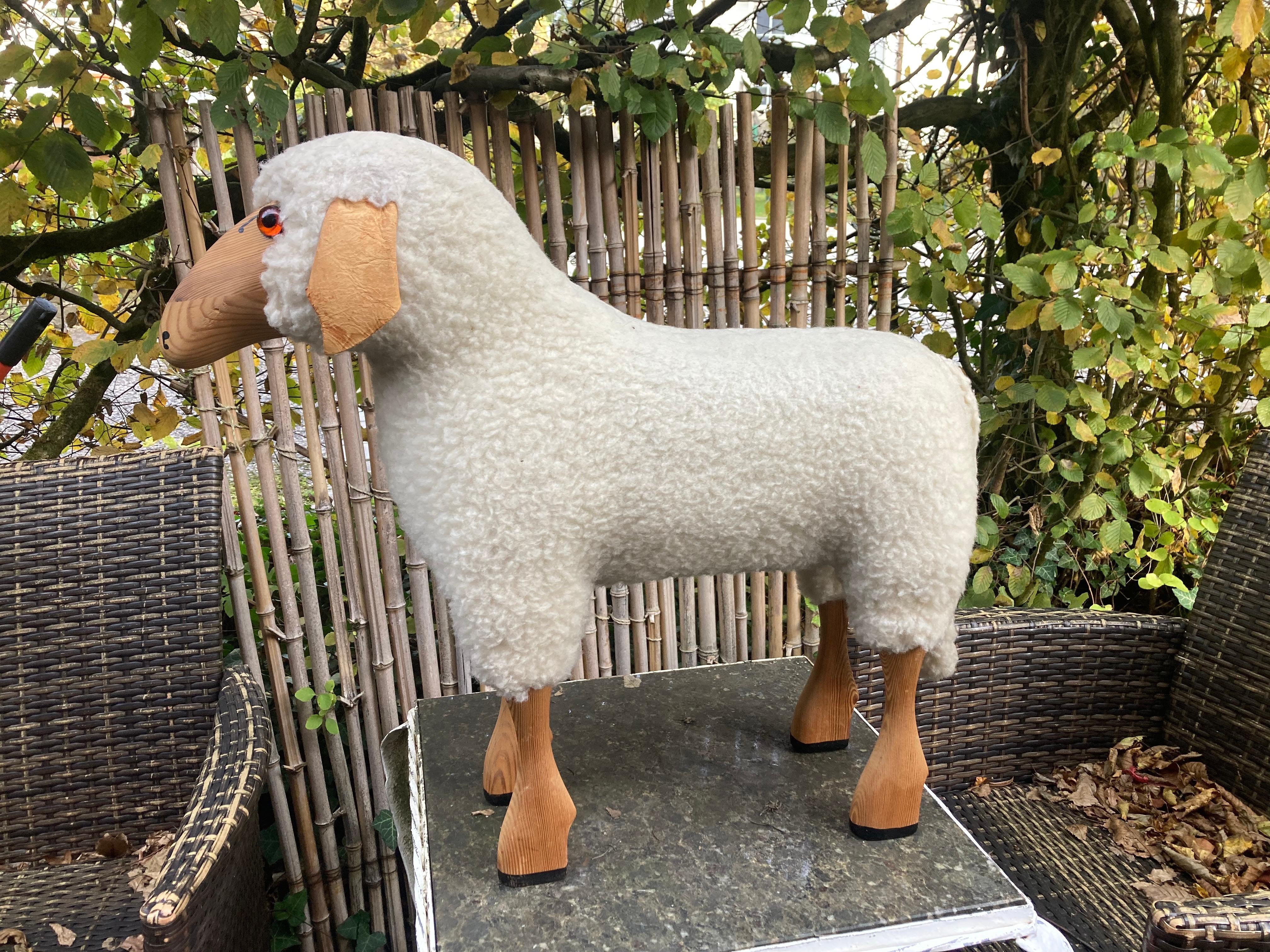 A white wool sheep by Hans-Peter Krafft. 1970s. Made in Germany.
The sheep was handmade from original white wool, leather and solid high-quality beech.
The entire production took place in Germany. The sheep originally served as a stool but are now