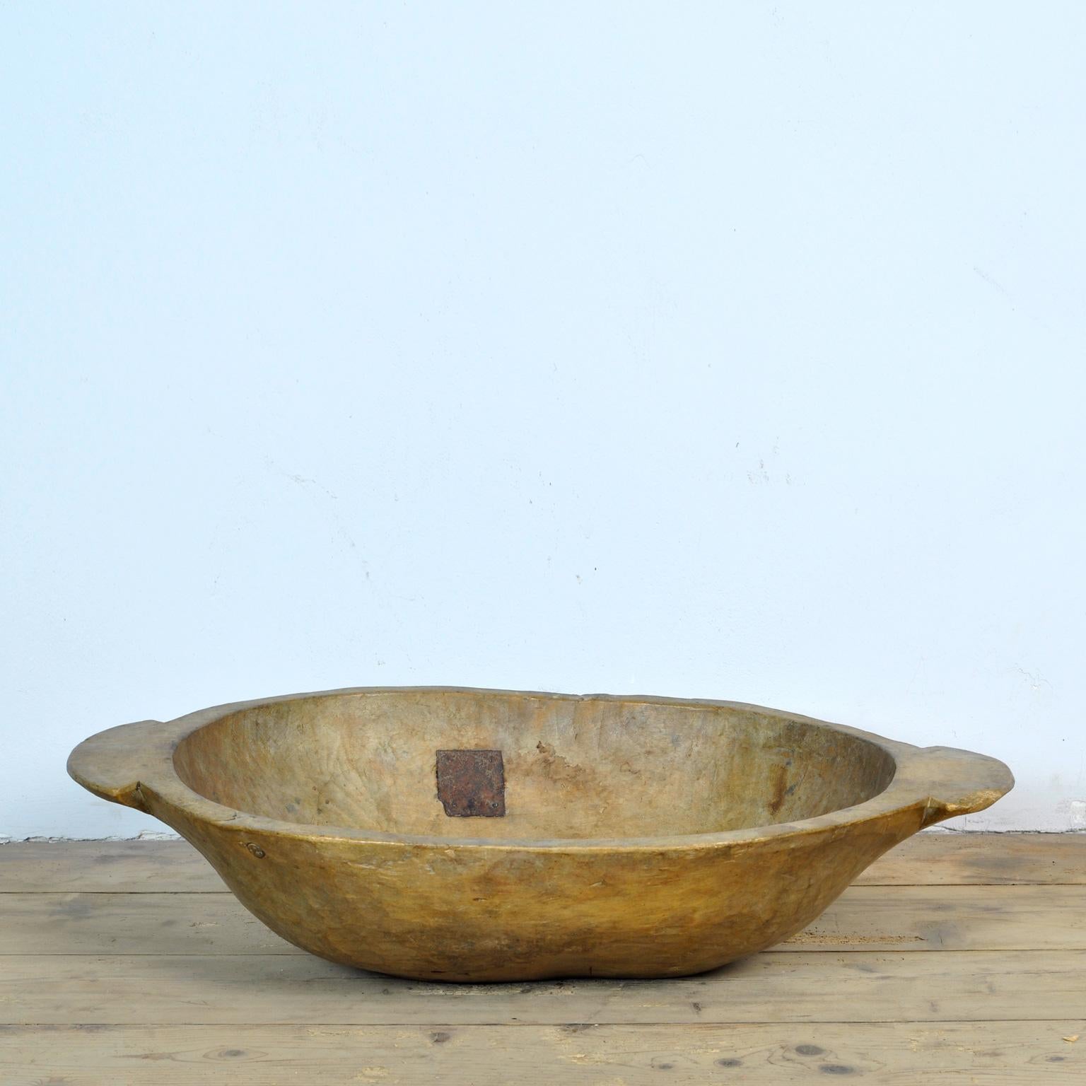 Beautiful hand carved Hungarian dough bowl, circa 1920's. Made of fruitwood. Two repairs have done in the past.
In good condition.