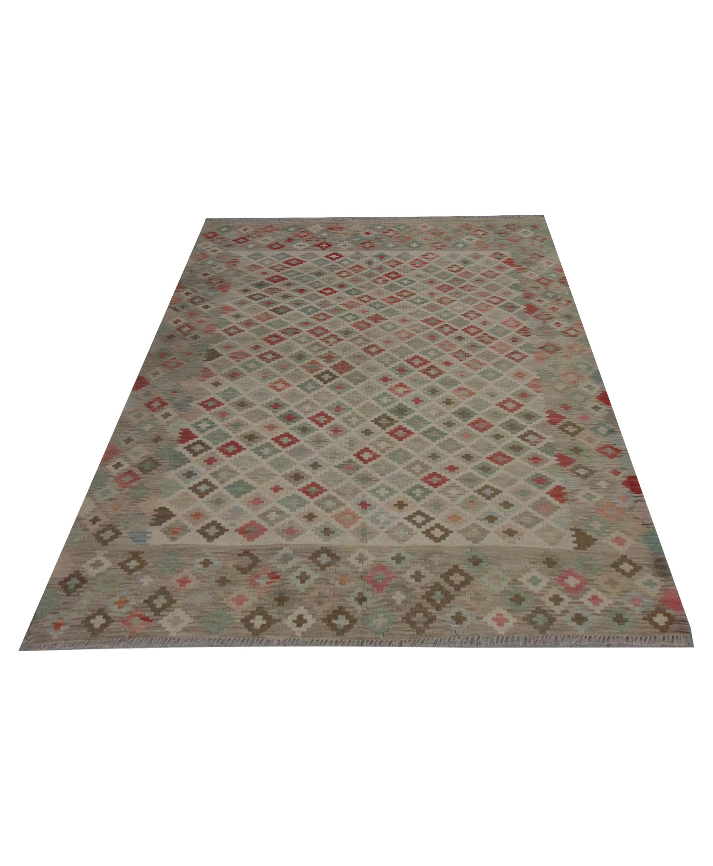 This decorative handwoven grey Kilim rug was constructed in the early 21st century in Afghanistan. The design has been woven with a bold geometric Scandinavian Style in accents of pink, Light brown, and grey on a subtle beige background. This is