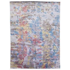Tapis en laine et soie fait à la main avec un design abstrait multicolore