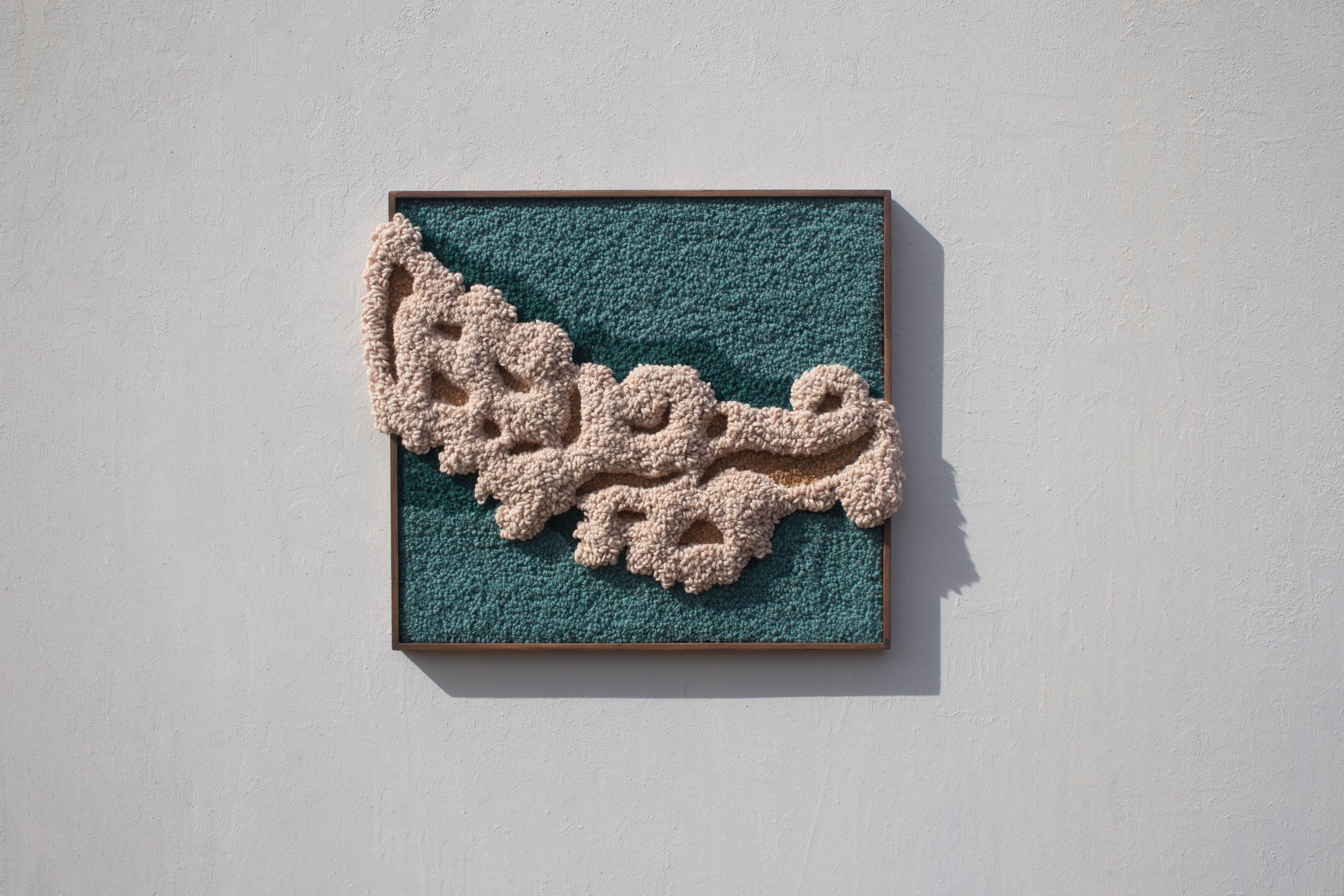Handmade using tufting technique and 100% Portuguese wool yarn with anti-moth treatment. The bass-relief is carved with scissors, creating different heights and a textured based landscape. The frame is designed and produced by the studio, made with