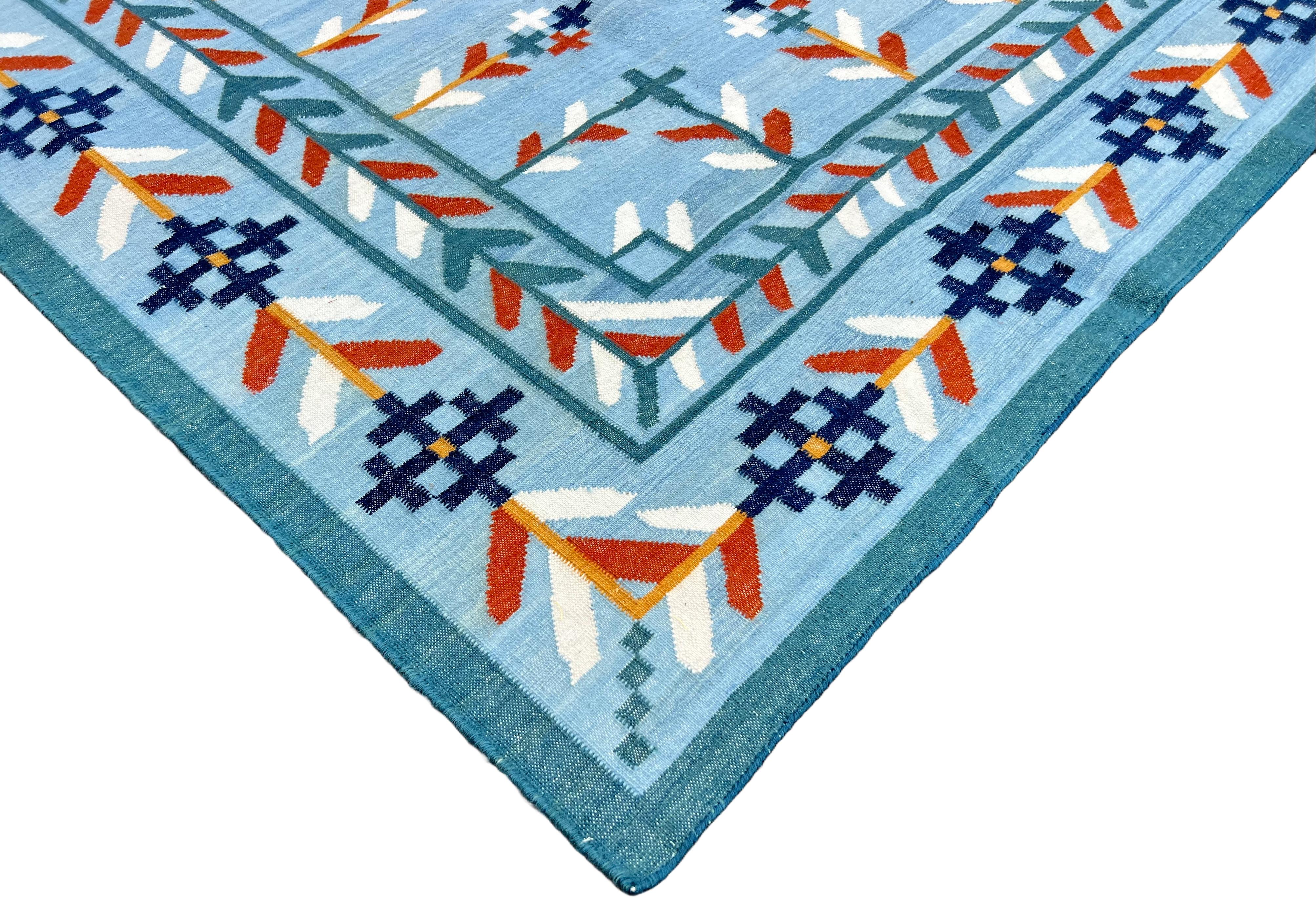 Handmade New Zealand Wool Vegetable Dyed Sky Blue, Navy Blue, Teal Blue, Terracotta, Mustard And Cream Leaf Patterned Indian Dhurrie Rug- 
Size 9' x 12'  

These special flat-weave dhurries are hand-woven with 15 ply 100% cotton yarn. Due to the
