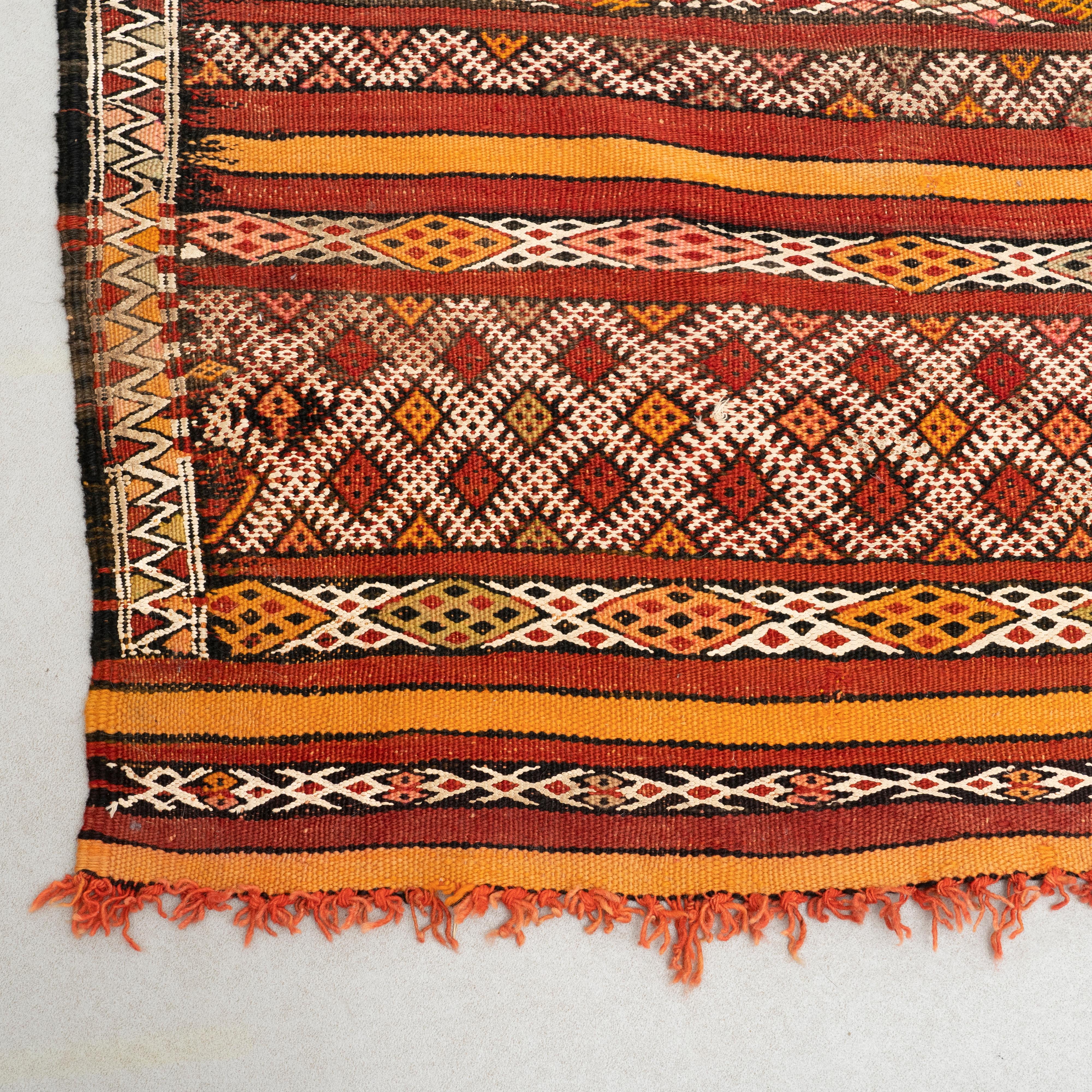 Handmade woven wool Moroccan rug.

Made by unkniown manufacturer in Morocco, circa 1960.

In original condition with minor wear consistent of age and use, preserving a beautiful patina.

Materials:
Wool.