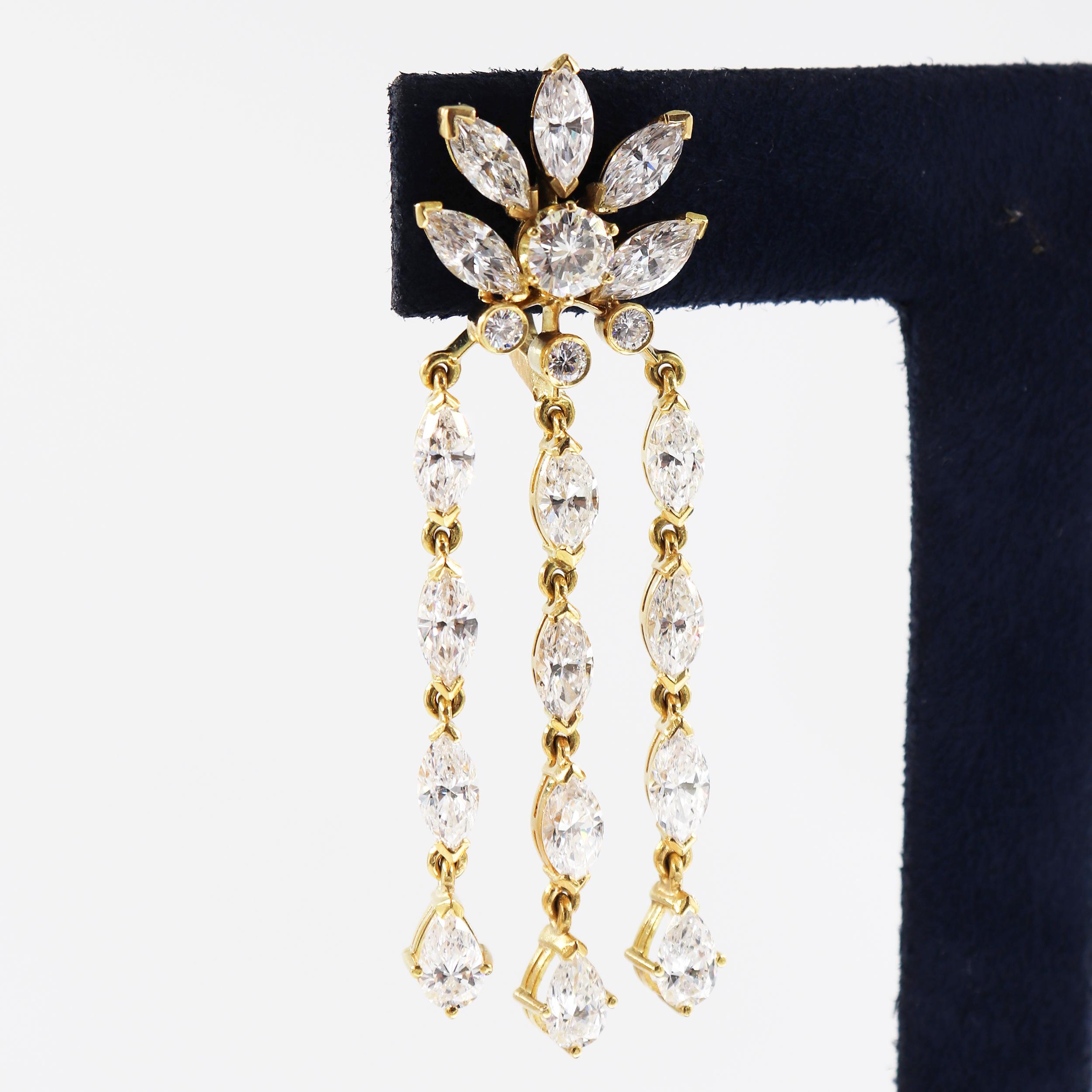 Those earrings, crafted in 18 karat yellow Gold, feature assorted round brilliants, marquises, and Pears shape diamonds for a total weight of approximately +13 carat. 

Stamped '750'

Type: Dangle Earrings
Stones: Diamonds
Cut: Round Brilliants,