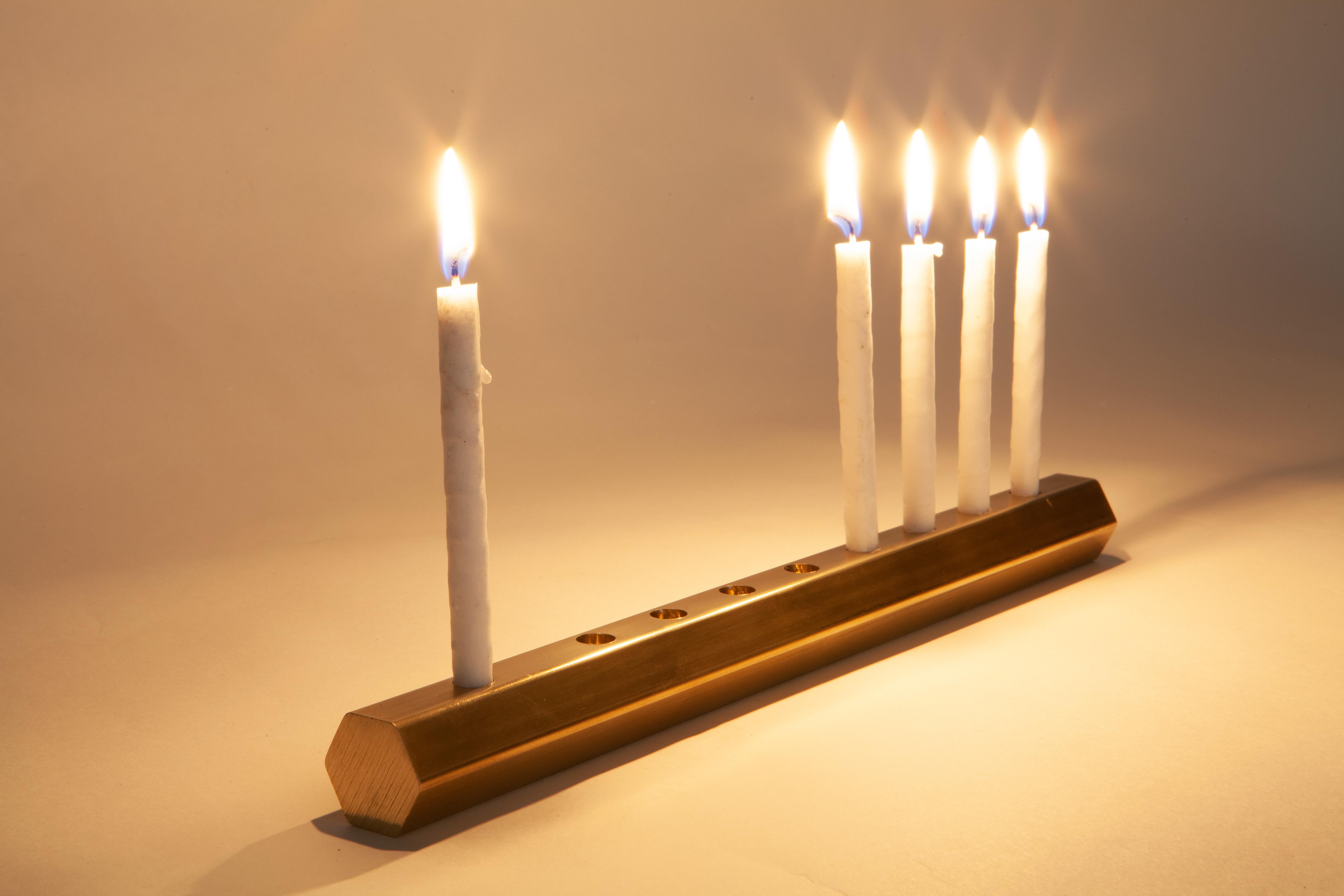 This New Menorah is made from Lead-Free Brass!* We also make an aluminum one.

It is all about the candles and candle-light.
It's Six-sided like the Star of David.
Zero waste, like all of our furniture.
It's the simplest, most elegant menorah I can