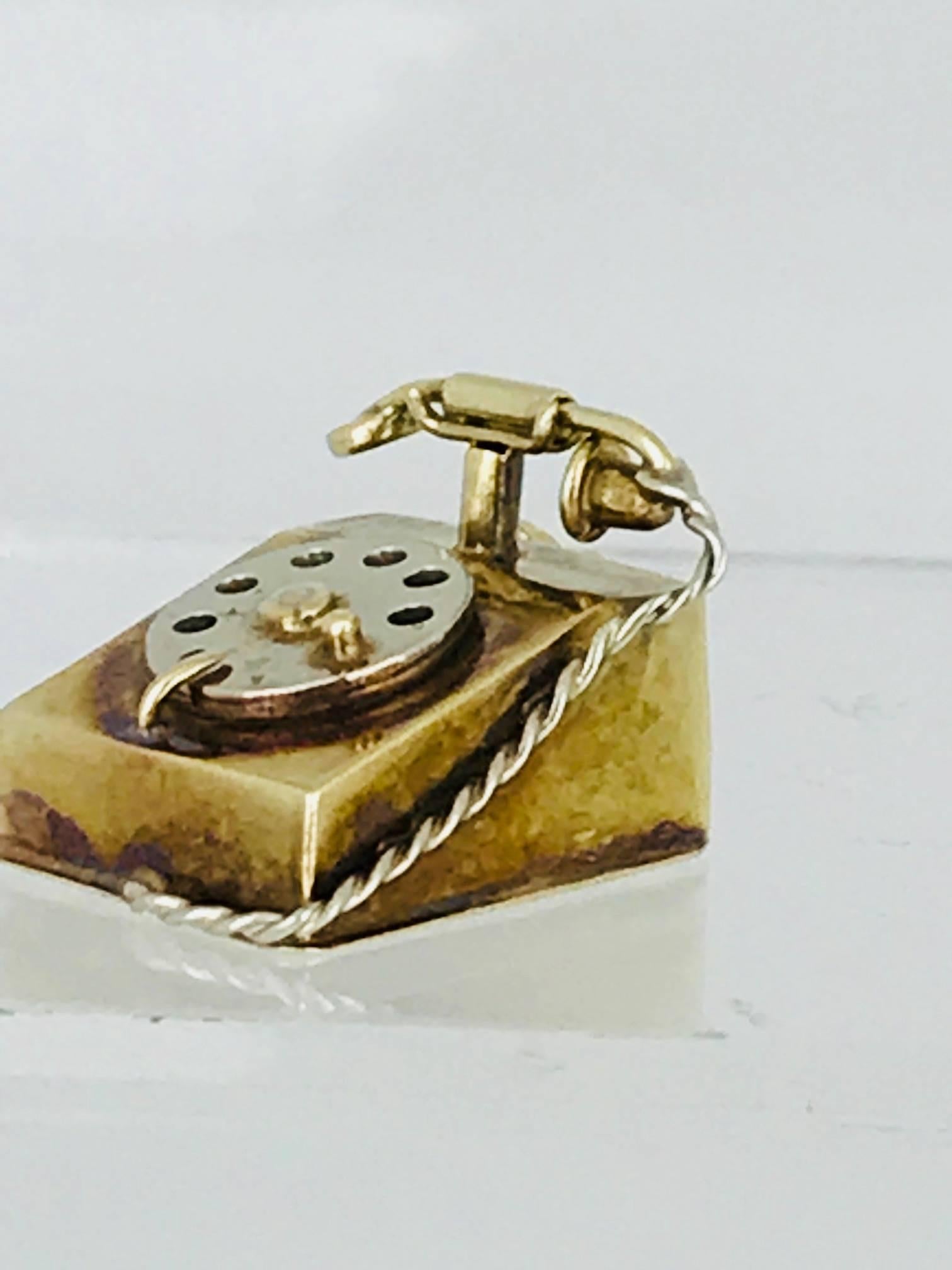14 Karat yellow and white gold Telephone Charm make in 14 karat gold. 
The charm has detail and is handmade.
The circa is 1960
Modern

GIA Gemologist, inspected & evaluated
