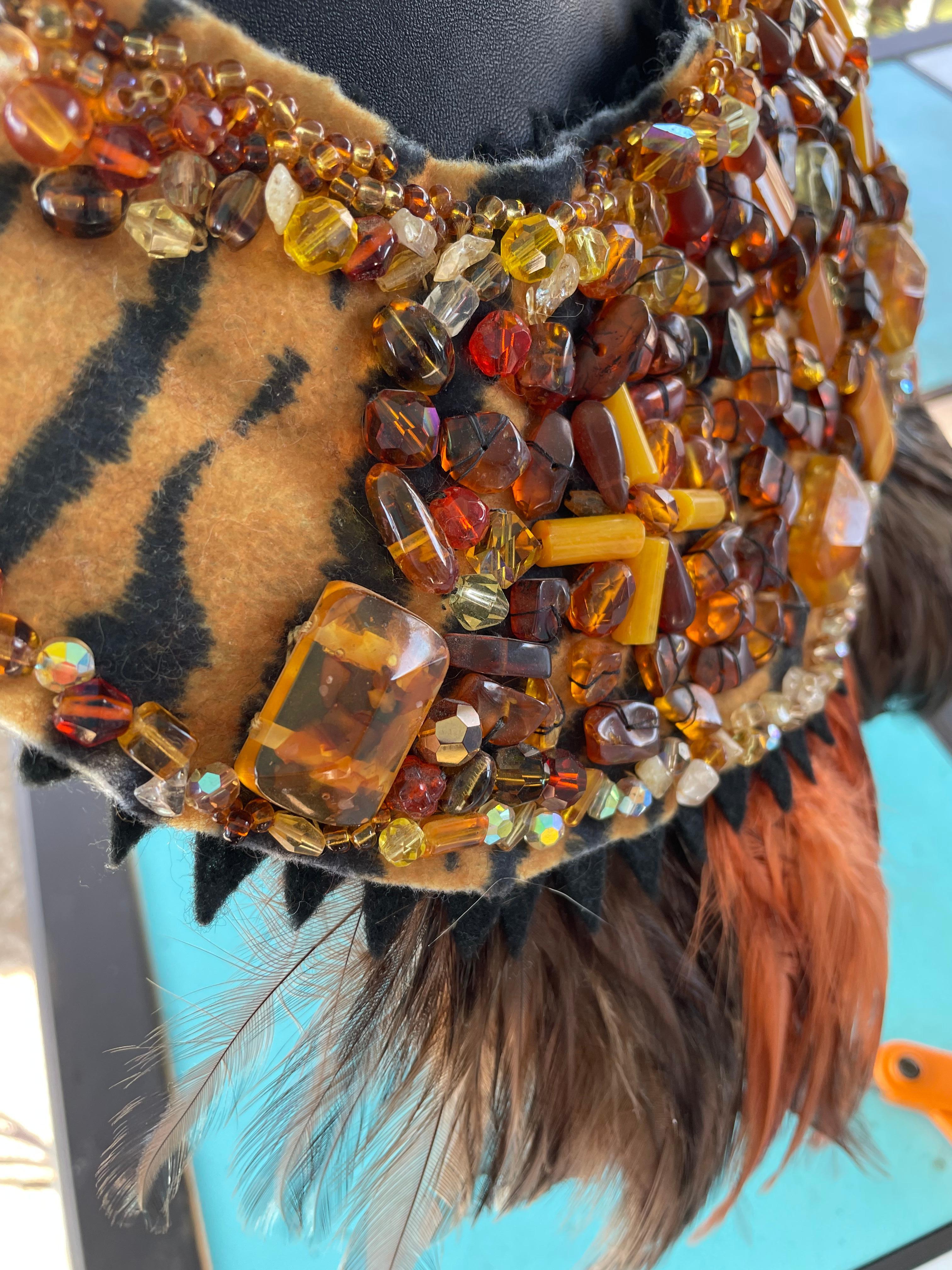 Handmade,one of a kind ,statement,Ethnic style beaded collar necklace from Lorraine’s Bijoux is on offer. All beads and stones are hand sewn onto wool felt in a tiger print and there is a sawtooth black felt edging around the perimeter. The stones