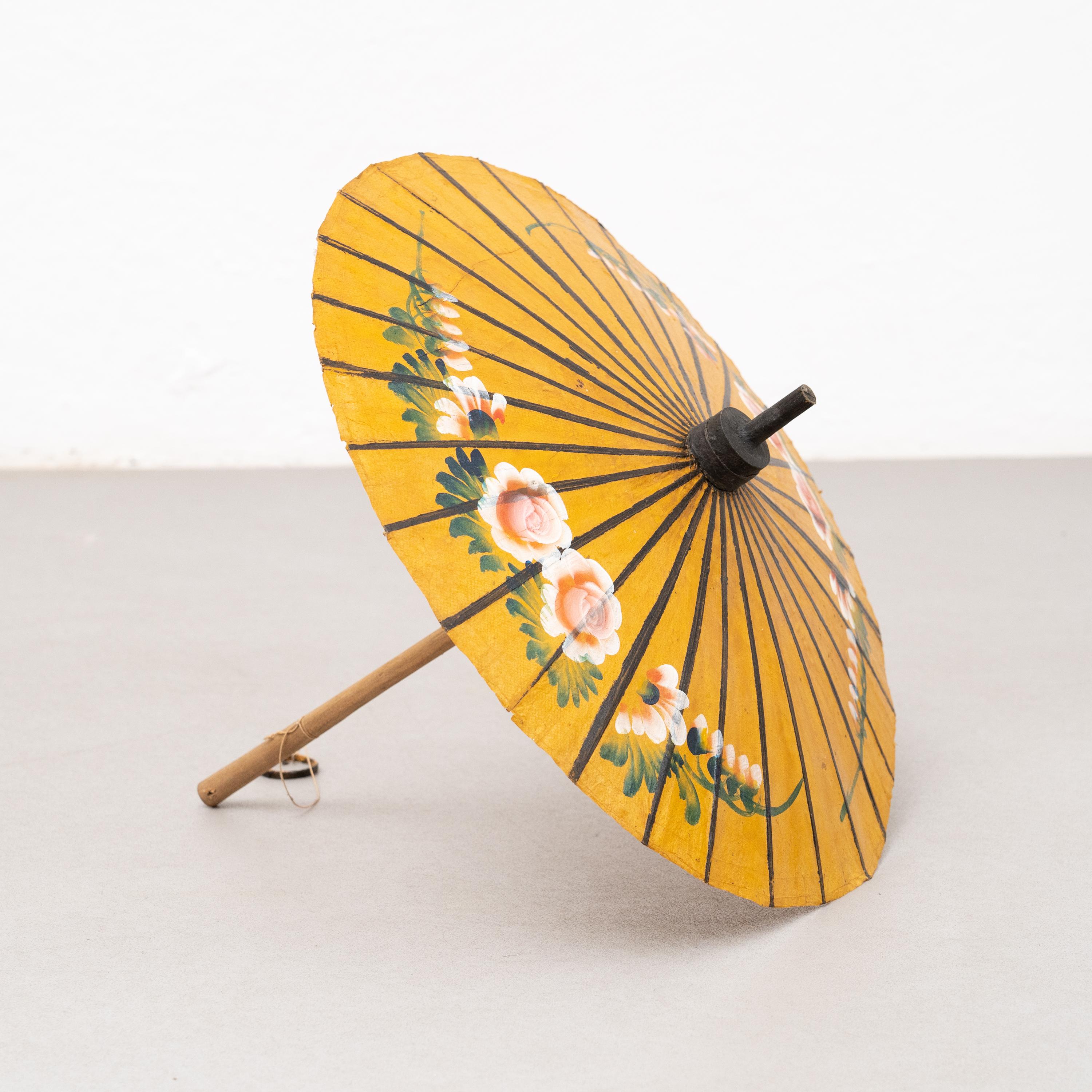 Handpainted bamboo umbrella.

By unknown artist, circa 1950

In original condition, with some visible signs of previous use and age, preserving a beautiful patina.

Materials:
Bamboo.

