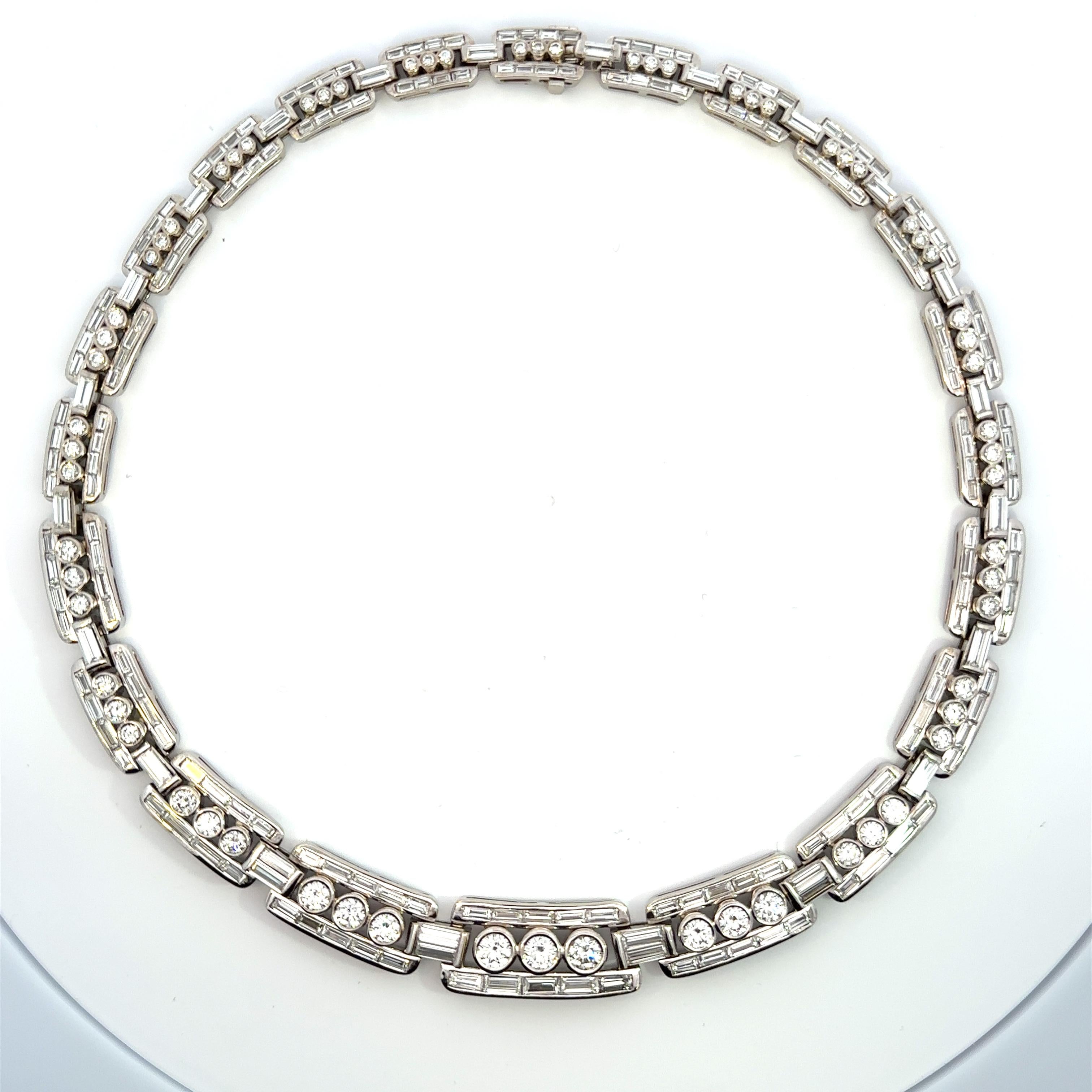 One of a kind handcrafted diamond evening necklace magnificently channel set with diamond baguettes and bezel set with brilliant cut diamonds in 18kt white gold. 

274 diamonds in total Weighing 24.13ct total weight F-G/VS quality

18kt white gold