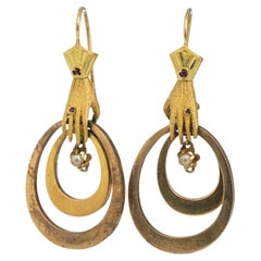
Hands
 Earrings in Gold 19th Century Victorians in 18kt Gold