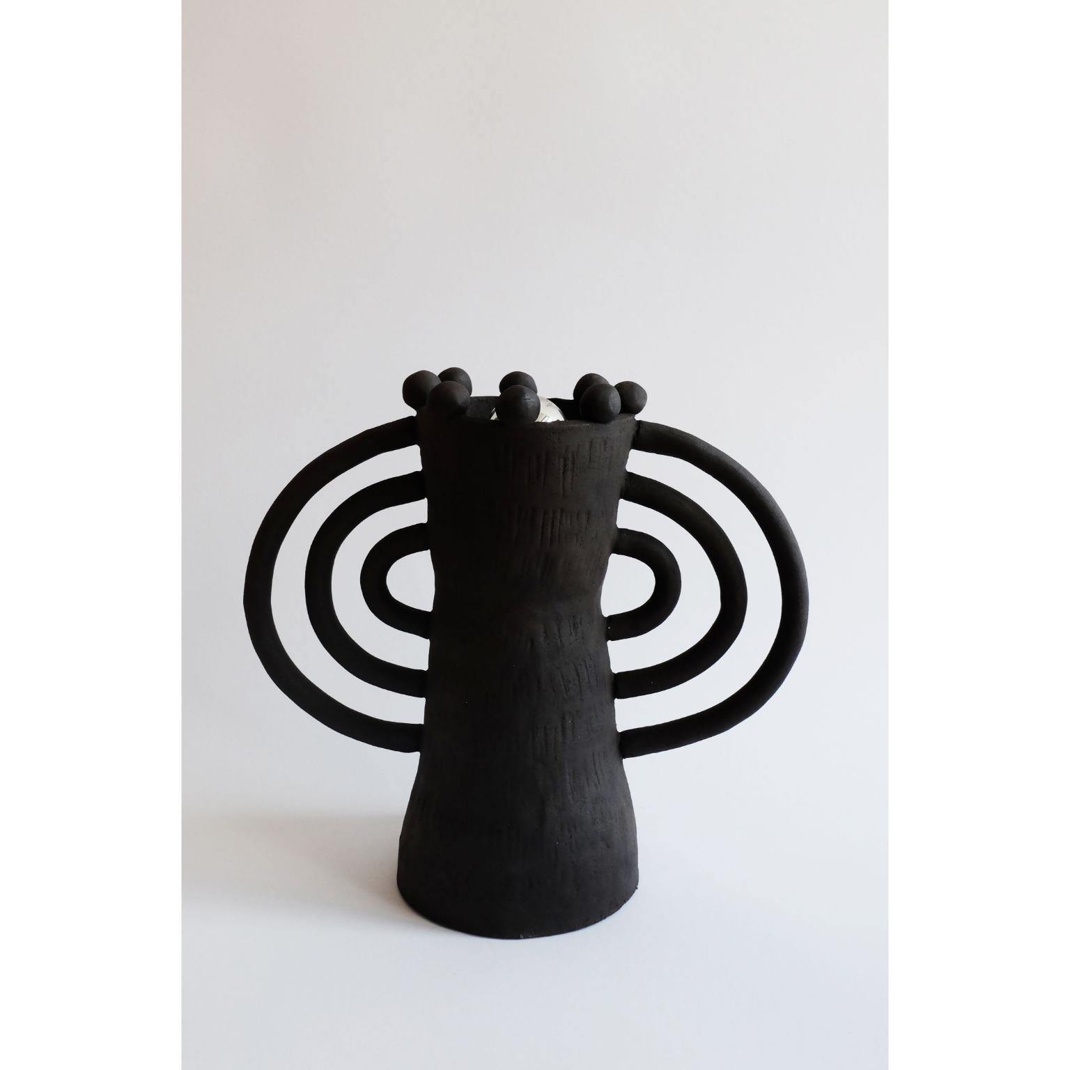 Handsculped Alcazar table lamp by Ia Kutateladze
Dimensions: W 32 x H 26 cm
Materials: Raw Black Clay

Alcazar lamp combines hand-built organic structure, with soft geometric elements and shapes, an object full of character.

IAAI / Ia