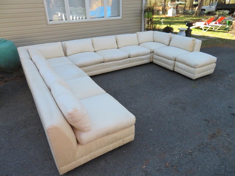 Handsome 6 piece Milo Baughman sectional sofa by Directional. This sofa retains its original fabric which does have some spots and stains on the cushions. We have not tried to clean so it may clean up with a steam cleaning. This sofa measures 27