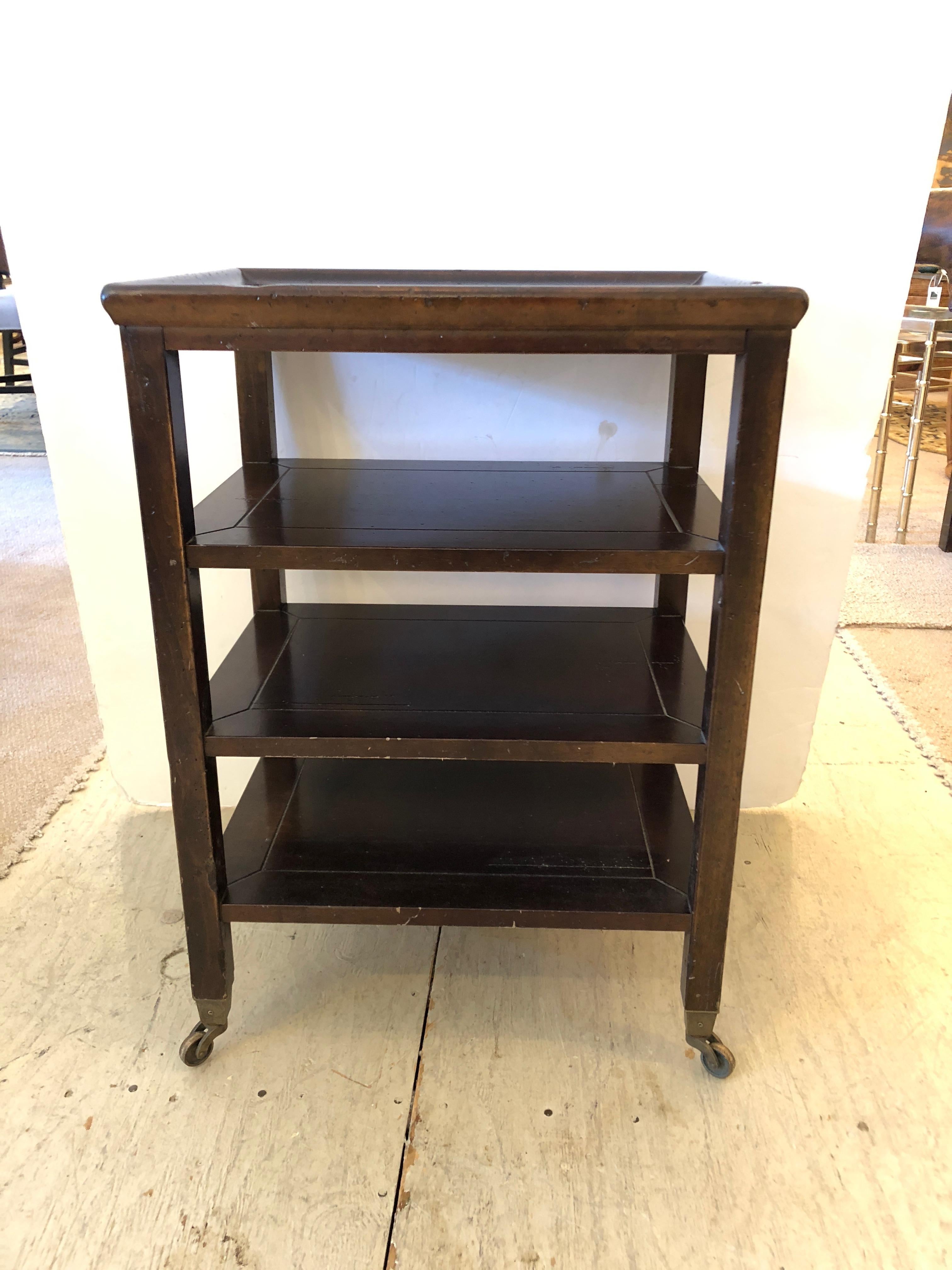 Very handsome, beautifully made heavy walnut side table by Baker having 4 shelves, 6