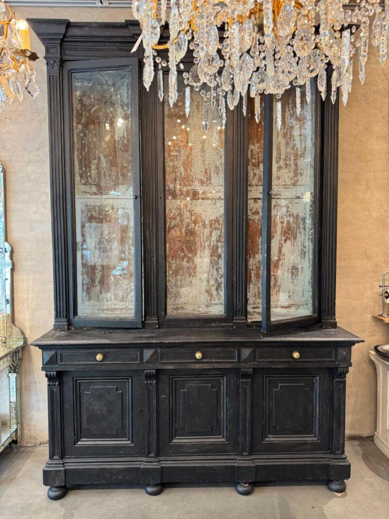 Large and handsome antique French 2-part vitrine cabinet / tallboy, with a display section and lower part with painted wooden doors, and adjustable wooden shelves and drawers.

This display case was originally a bookcase, and is from around 1890,