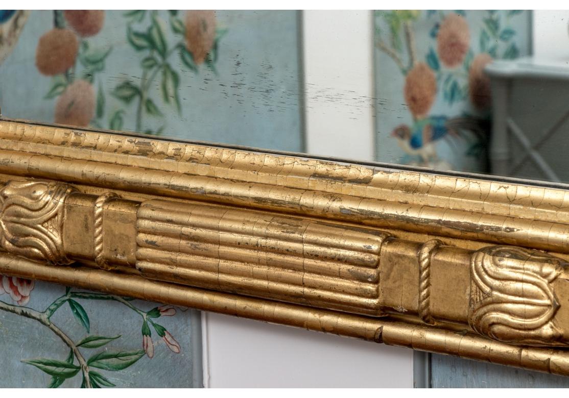 Edwardian Handsome Antique Carved And Gilt Finished Three-Panel Over-the-Mantel Mirror For Sale