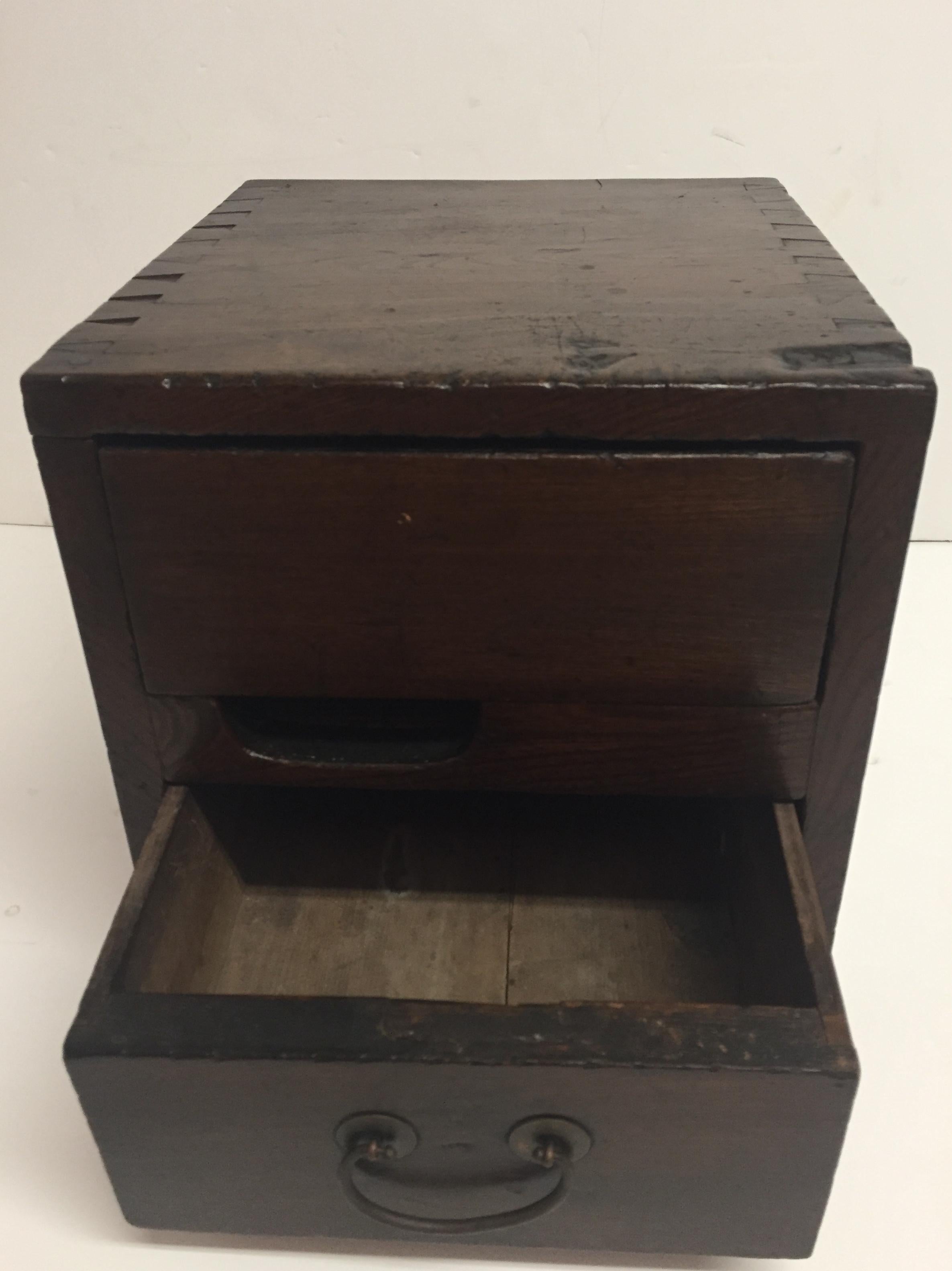 Beautifully made antique Chinese money box having drawer and dovetailed construction, circa 1910.
From the collection of Tim Hunt and Tama Janowitz.