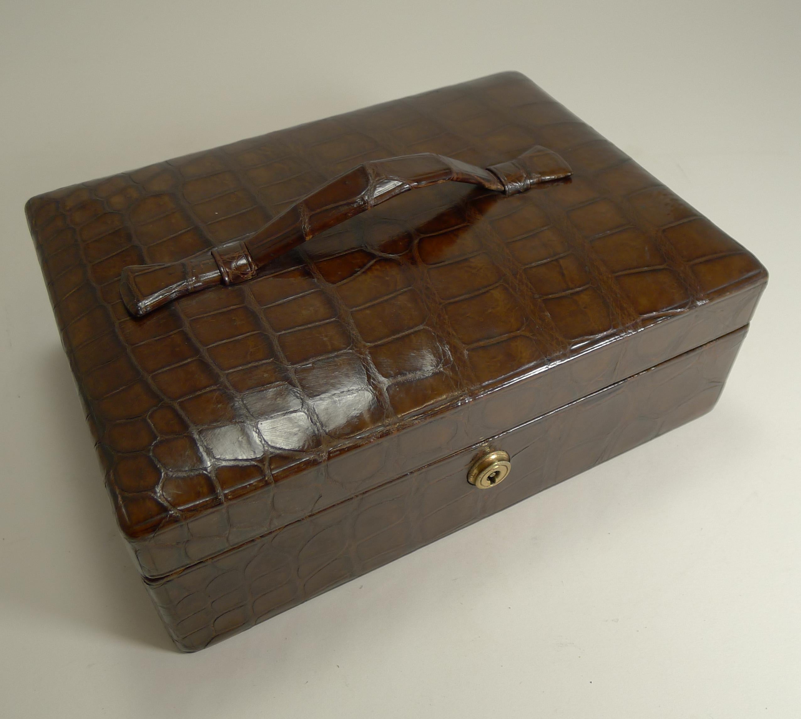 A stunning Edwardian jewellery box in a fabulous rich chocolate brown colour with an integral carrying handle to the top. The skin is in exceptional condition with a good glossy patina.

The box comes complete with a working key to lock and unlock