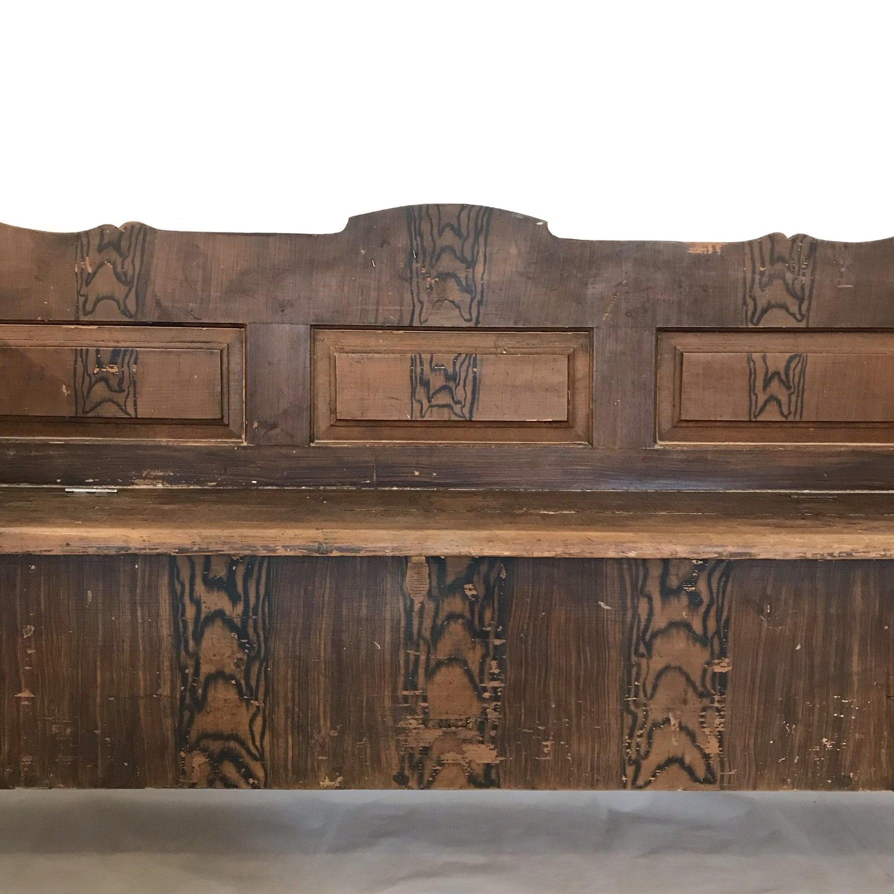 The gorgeous symmetry and hand painted faux finish on this antique Romanian Hungarian bench, circa 1875, remains as handsome today as when it was first created. Please be sure to use the enlarge and zoom functions to see the hand painted details of