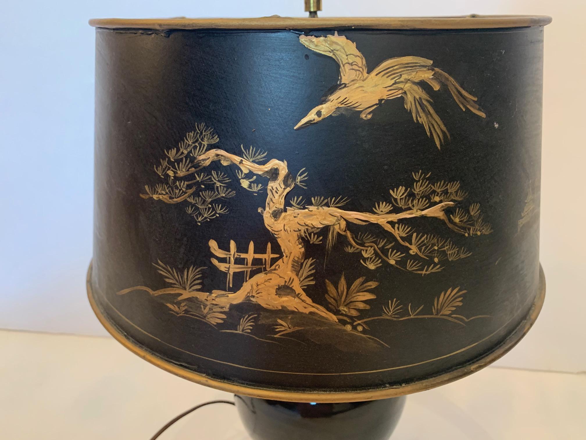 Great looking glossy black ginger jar ceramic lamp on carved rosewood base having handsome black and gold paper chinoiserie decorated shade.
Lamp itself 6