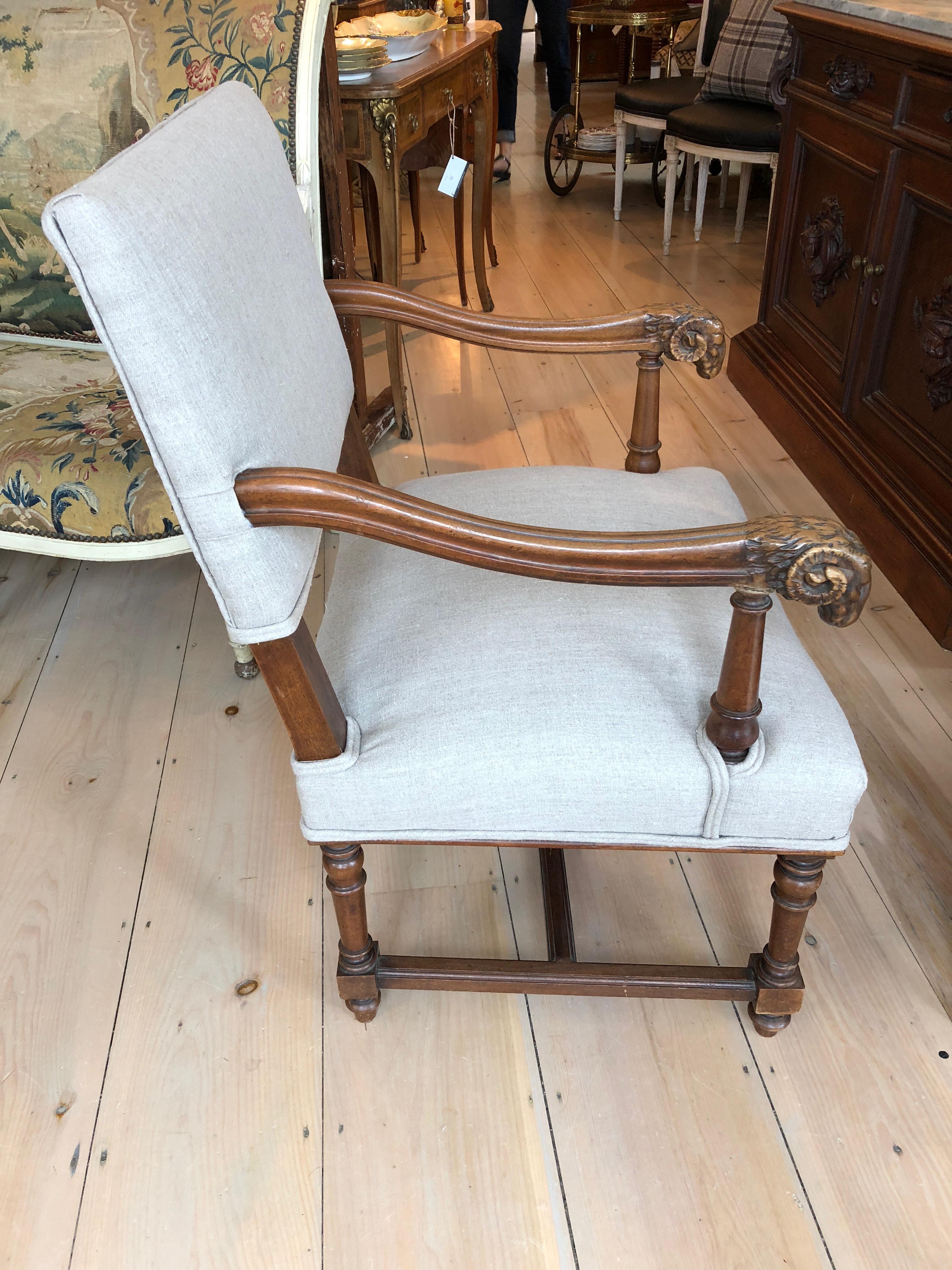 French Handsome Carved Walnut and Linen Armchair with Ram's Heads