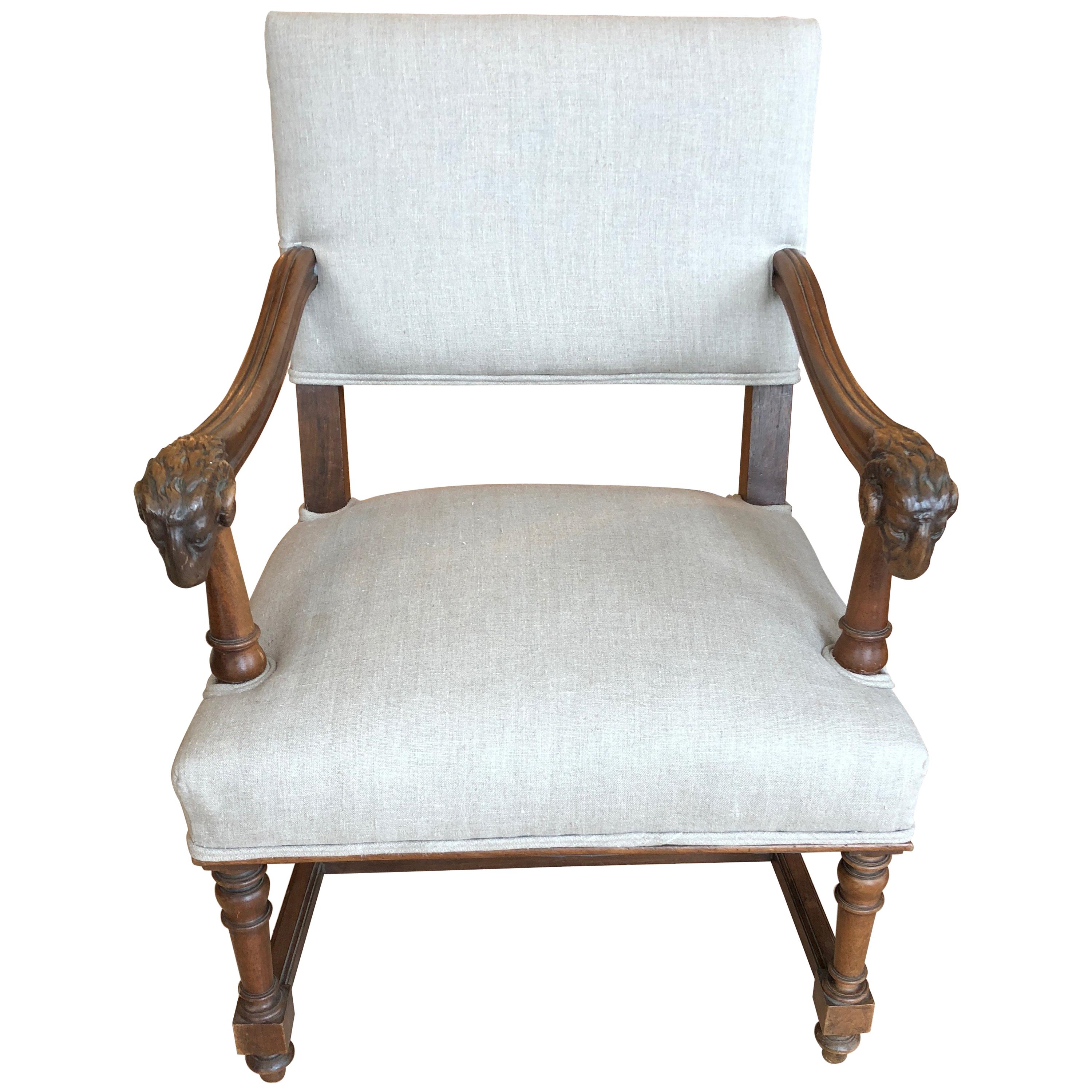 Handsome Carved Walnut and Linen Armchair with Ram's Heads