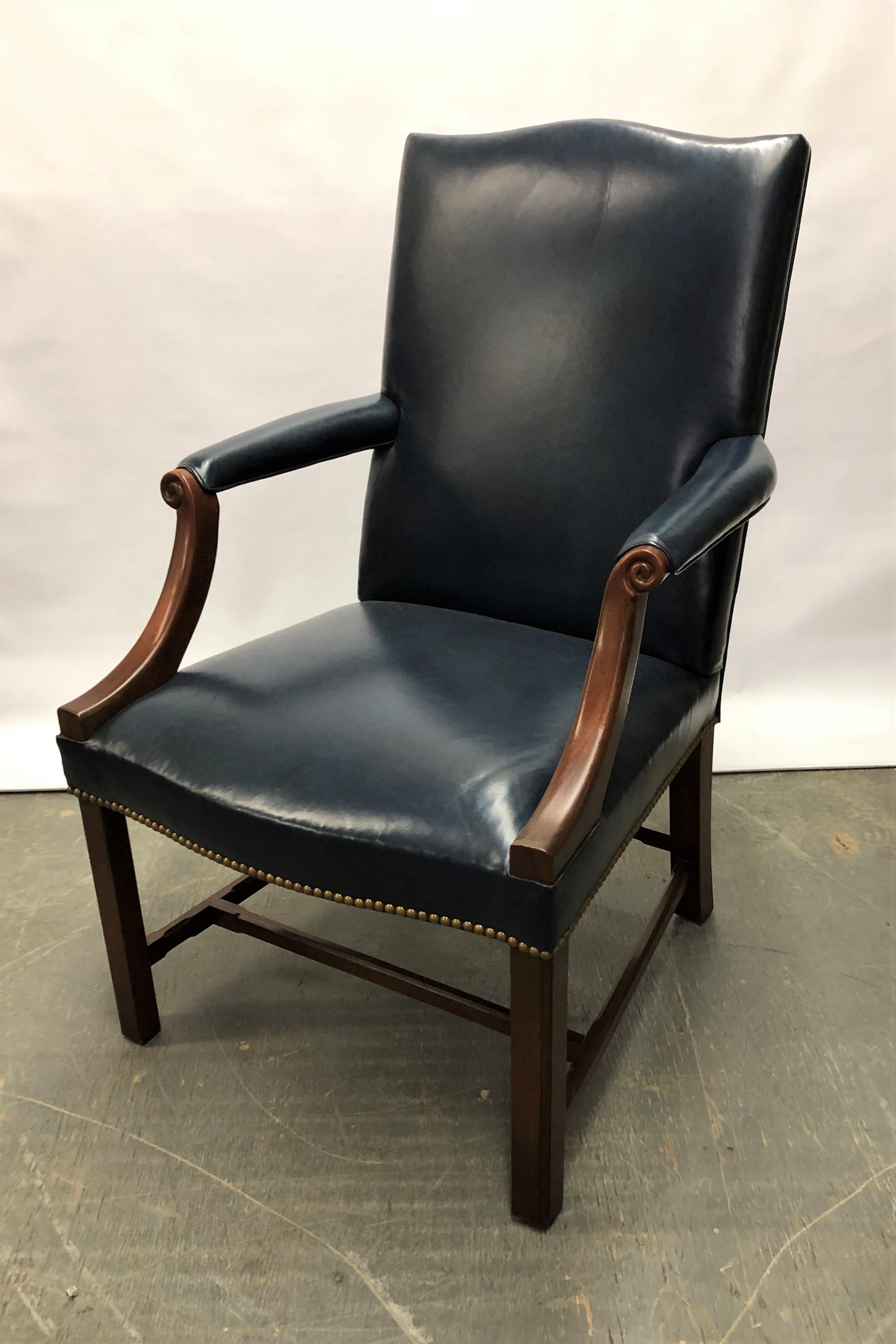 This handsome Chippendale style Mahogany Gainsborough chair sits comfortably in the office, den, library or living room. The serpentine shaped top and seat front, along with, the uncommon chamfered stretcher add to its distinction. This important