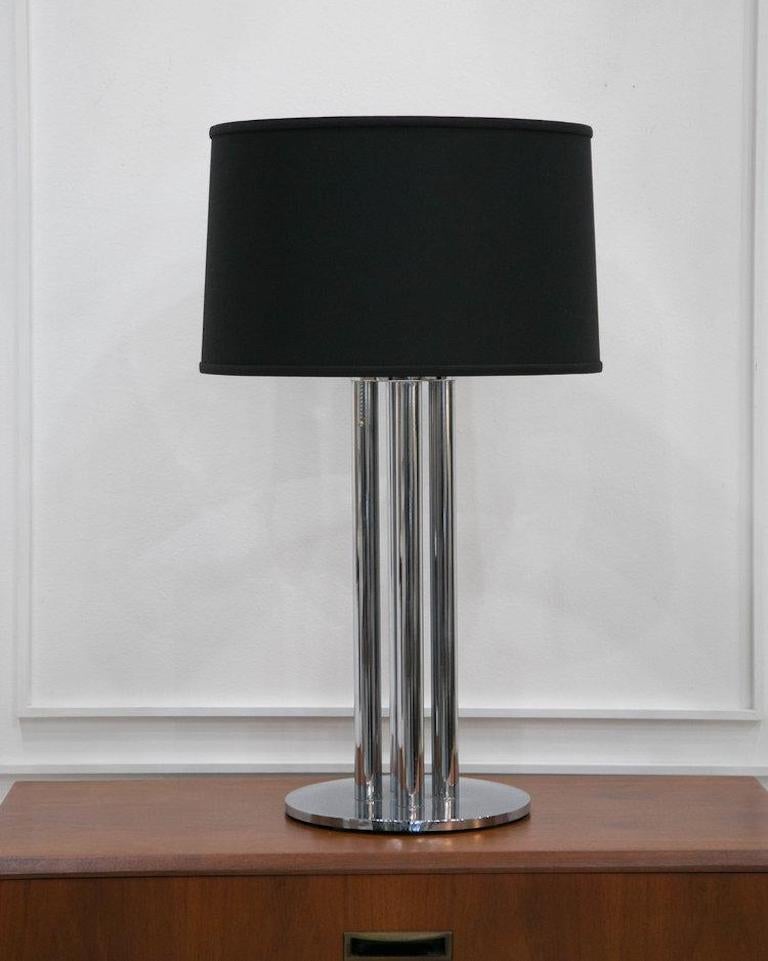 A pair of very handsome midcentury lamps featuring a four narrow chrome columns on a 10” diameter base. Lampshade not included, please inquire for availability of options.

Dimensions: base: 10” diameter; 31” total height 

Condition: Excellent.
