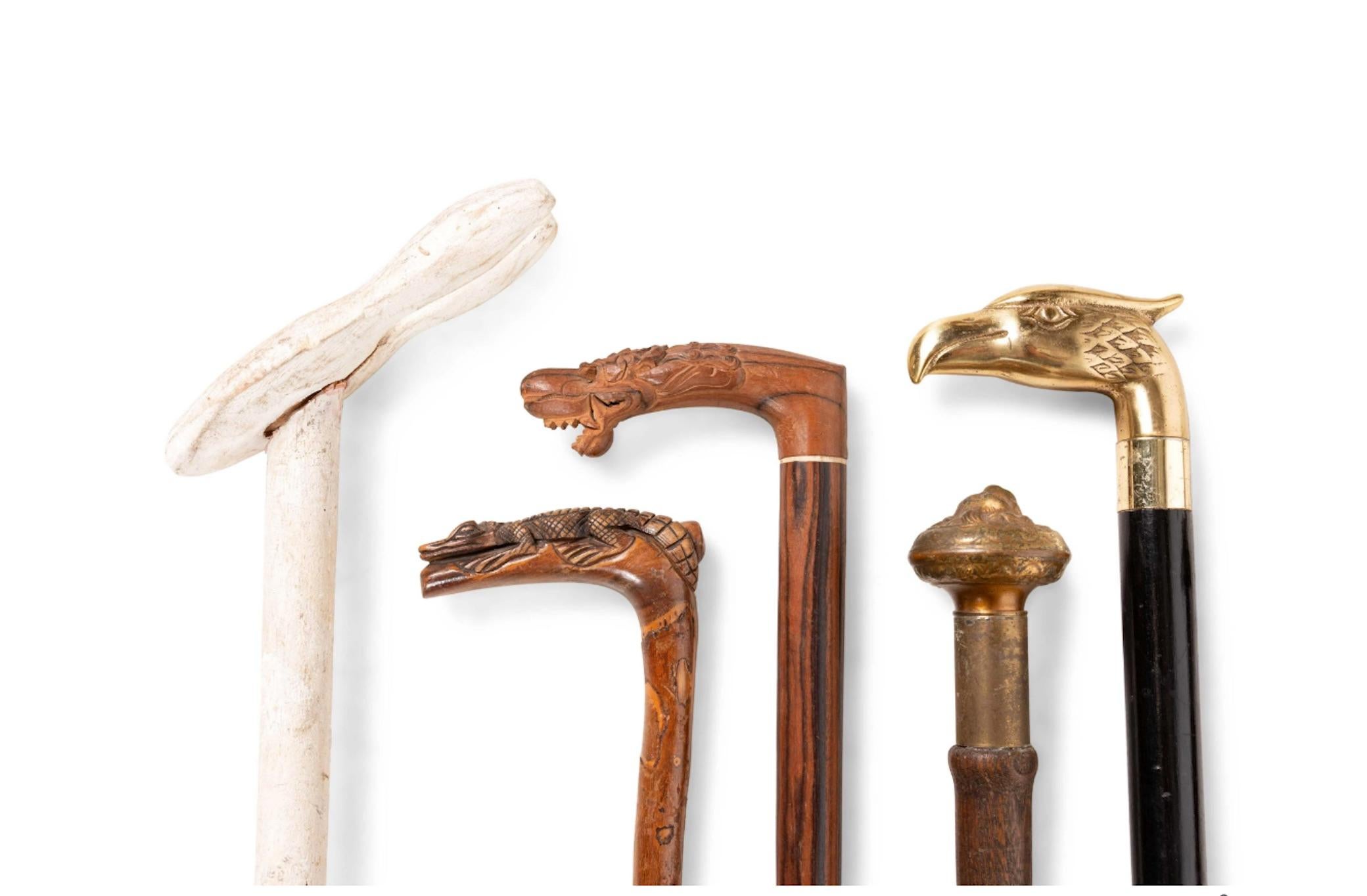 Handsome collection of 16 19th century English walking sticks, some with daggers. Priced Per walking stick.