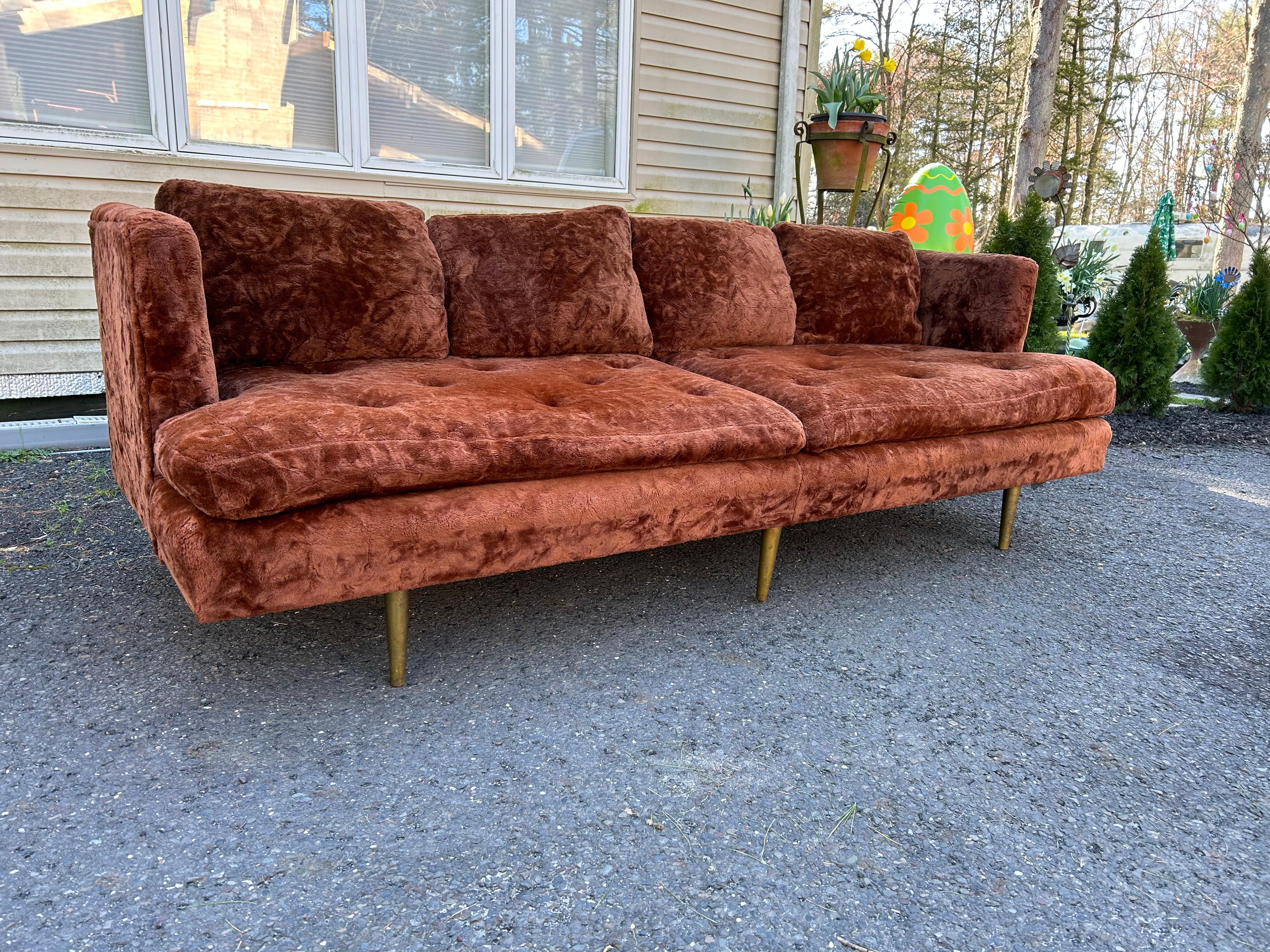 Handsome even arm sofa by Edward Wormley for Dunbar with brass legs. Model 4906. This piece retains its original fun fur teddy bear fabric in usable condition.  The foam in cushions has flattened but the back pillows are down filled and still plump.