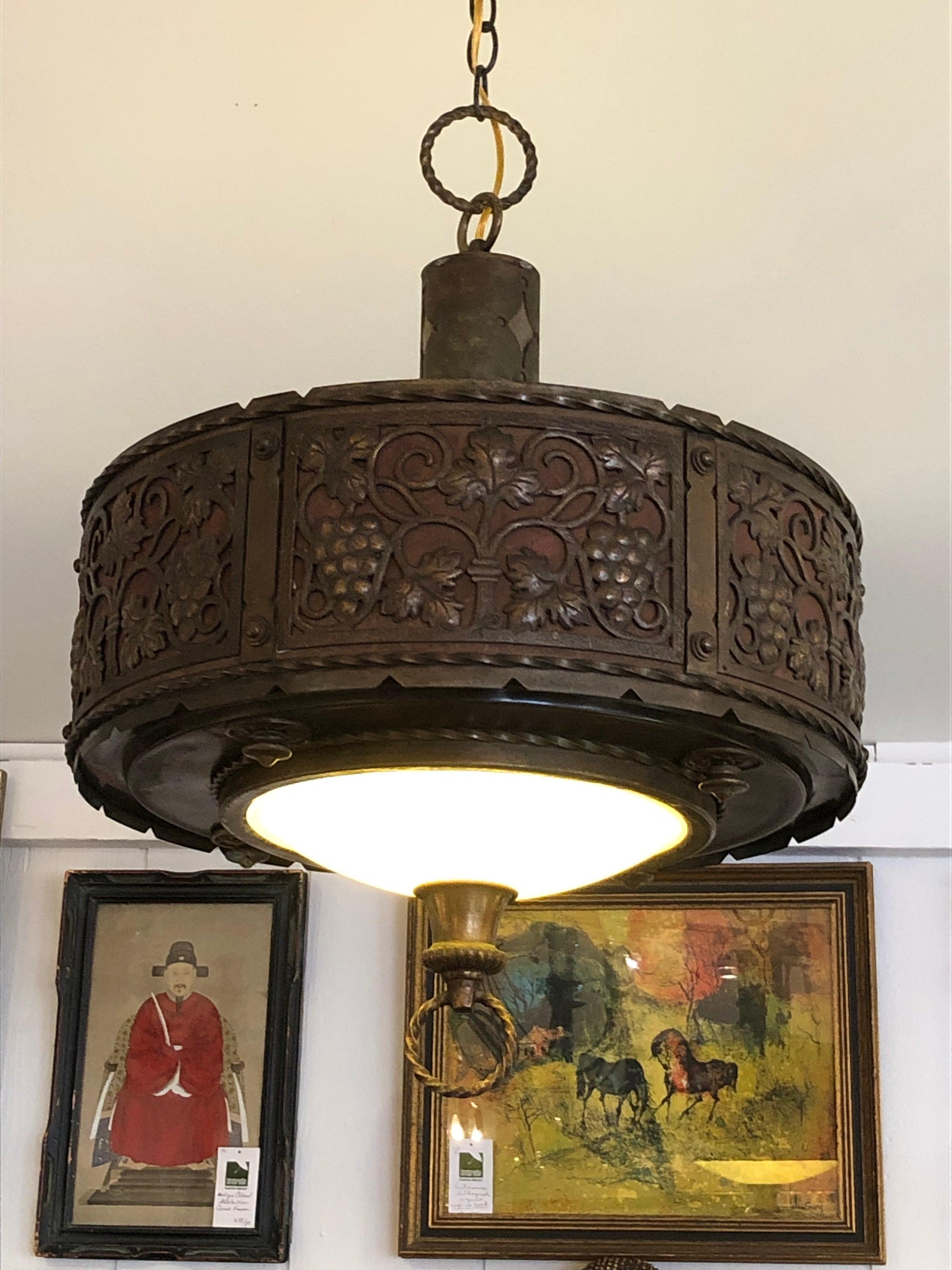 Gorgeous embossed copper and brass light fixture in the manner of Oscar Bach having wonderful shape with internal yellow hue art glass bottom.
Note: Pair available

(Sorensen)