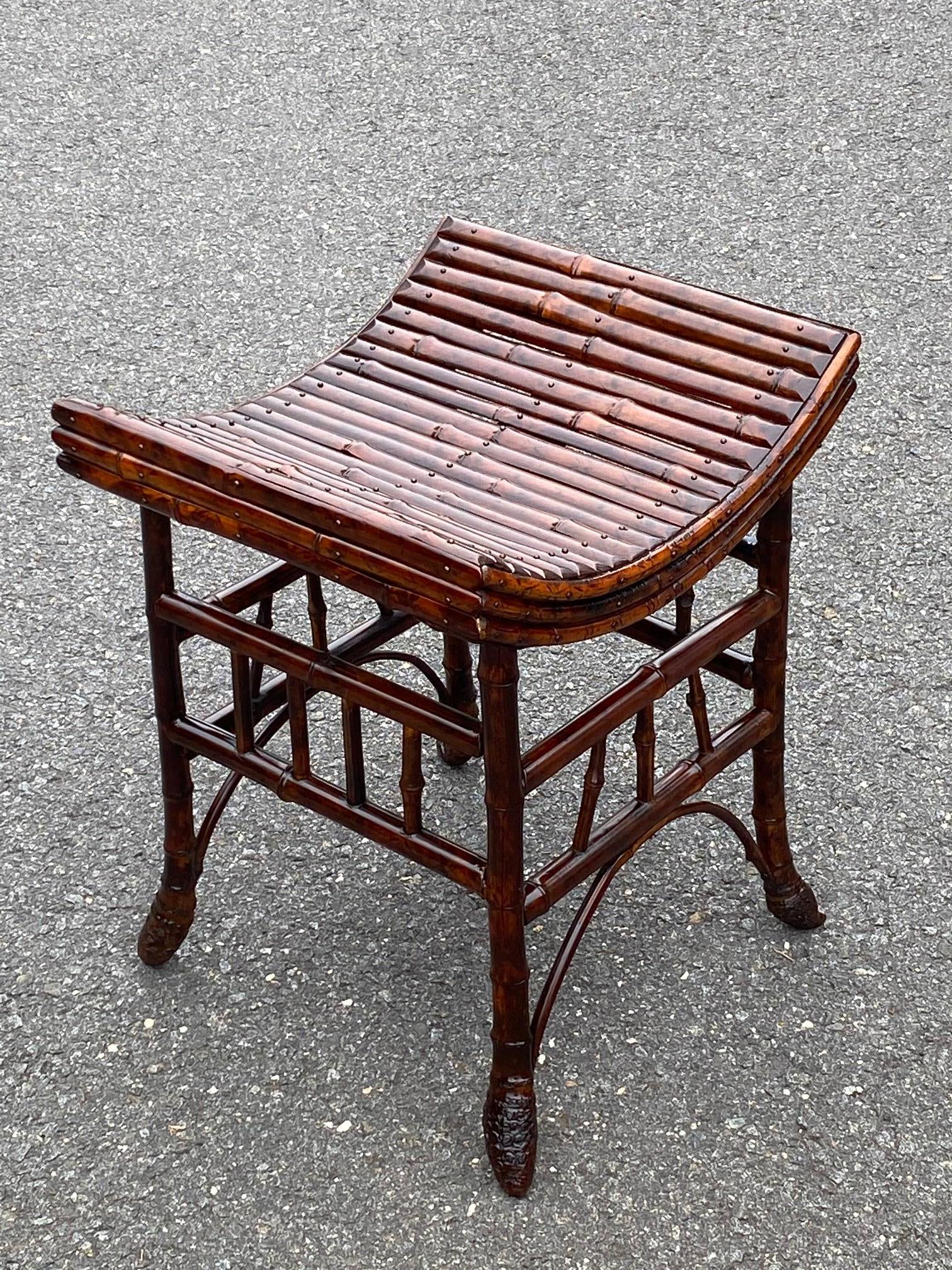 Beautiful antique bamboo bench or stool from England having a warm faux tortoise finish and lovely curved seat.

           