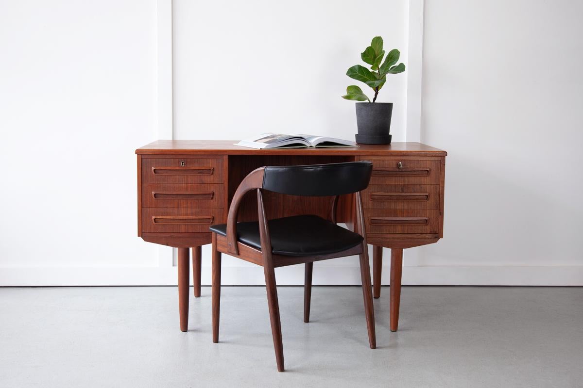 A handsome executive desk with six drawers at the front and three open compartments to the rear for extra storage. This desk displays the classic, simple and sophisticated aesthetic of mid century design perfectly.

Dimensions: Width 122cm / Depth