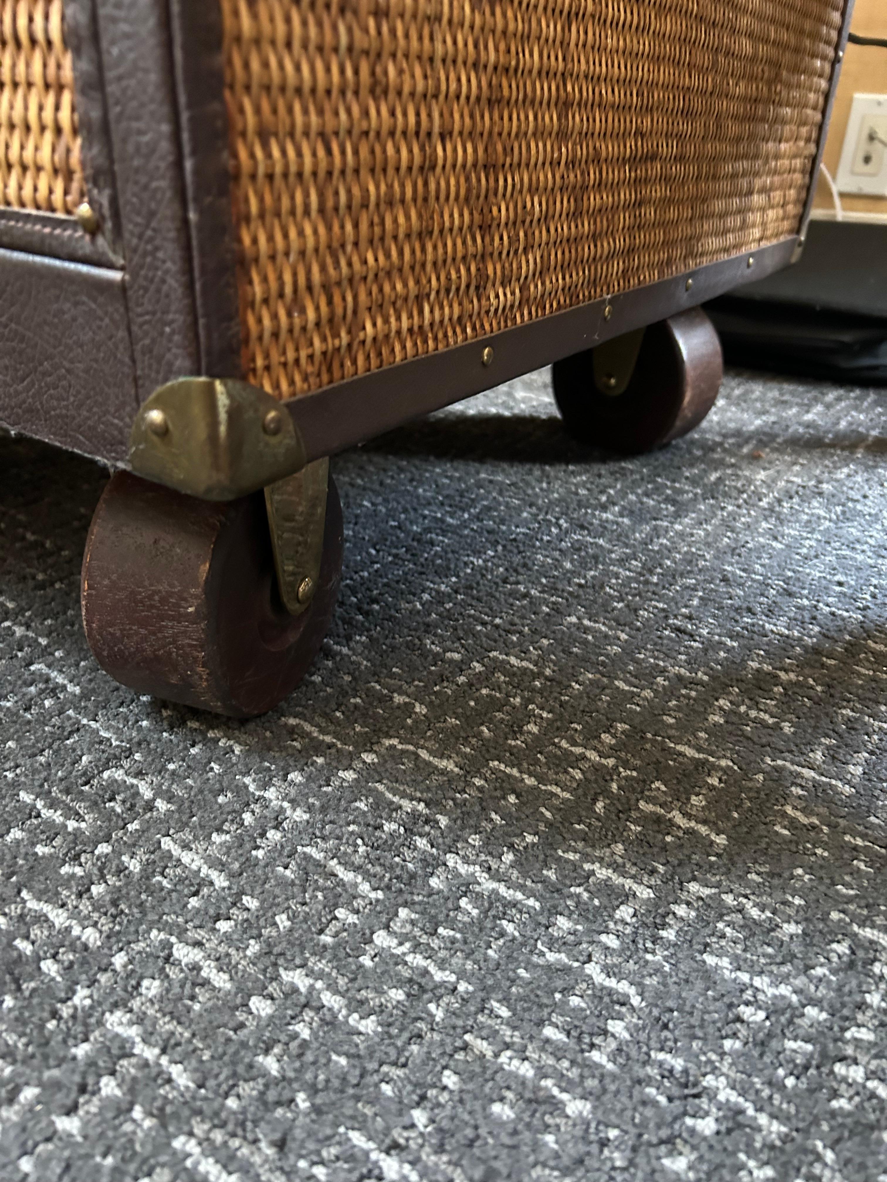 Great looking addition to your office or library, a Stiles Brothers file cabinet with stunning woven rattan and leather design.