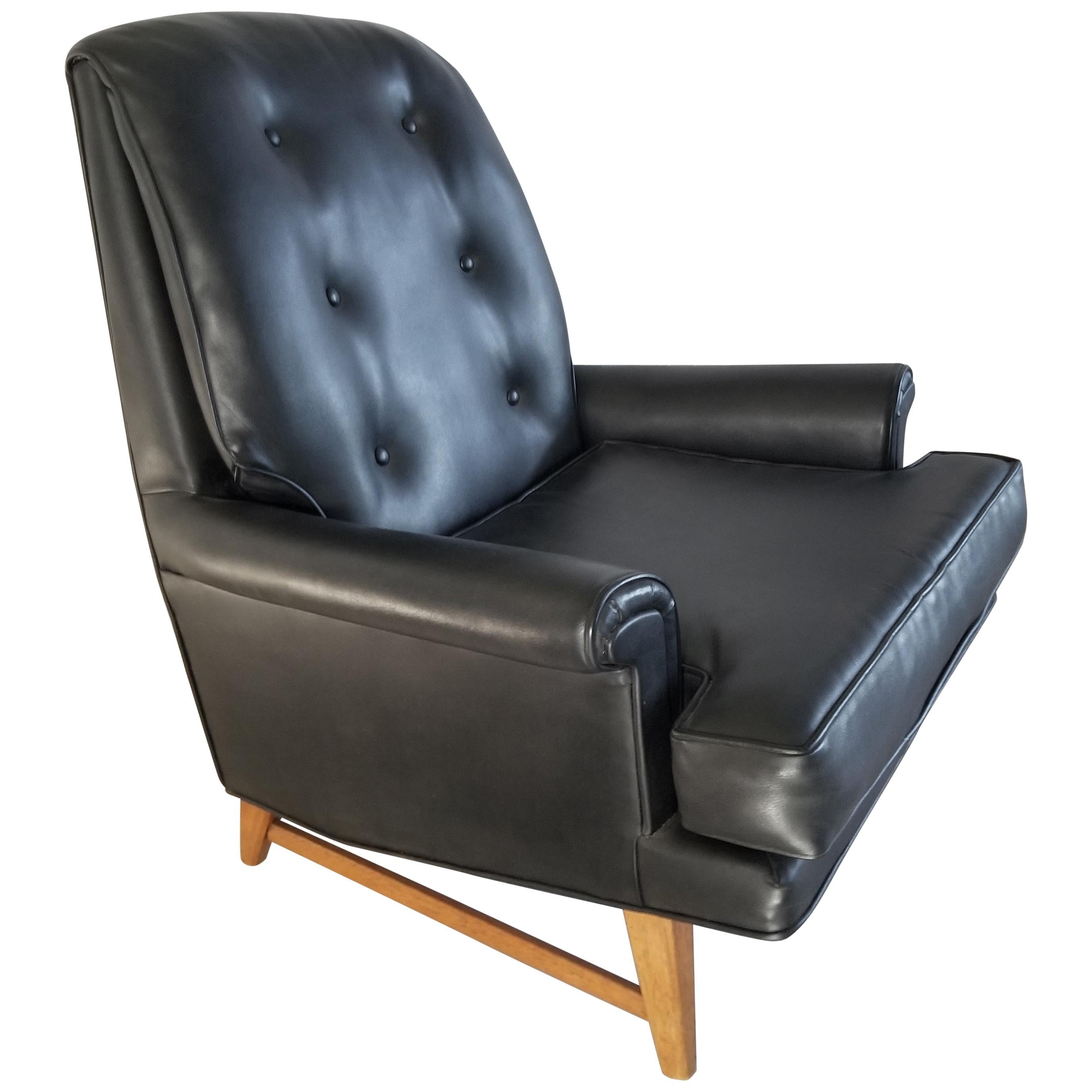 Handsome Heritage Black Faux Leather Lounge Chair 
Edward Wormley for Dunbar Furniture Era Classic 1950s
Faux leather that really looks like leather.
Comfort and good looks perched on a strong mahogany wood base.
Signed Heritage label
32.5 W x 35.5