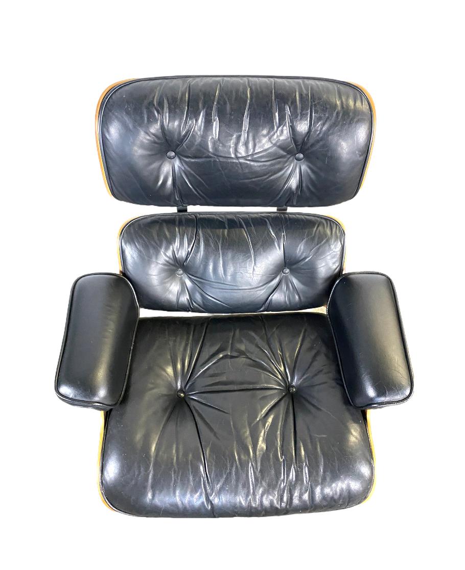 A gorgeous vintage edition Eames lounge chair and ottoman, circa 1970s. Classic Herman Miller edition in stunning vibrant wood with black leather. Handsome grains pattern but not too loud. Extremely comfortable foam cushions with no hardening. Chair