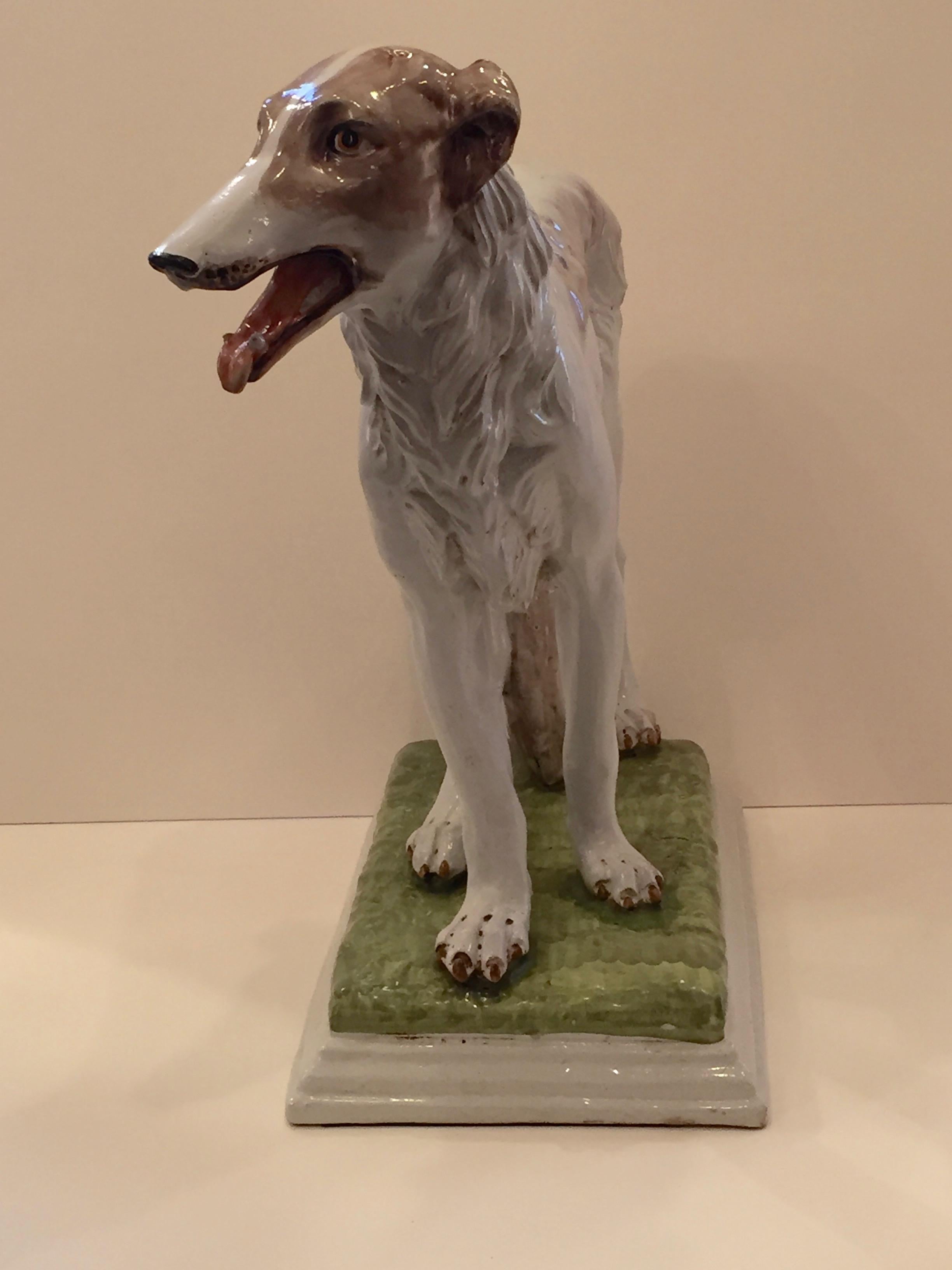 Wonderful glazed terracotta sculpture of a Russian Wolfhound with an impressive scale.